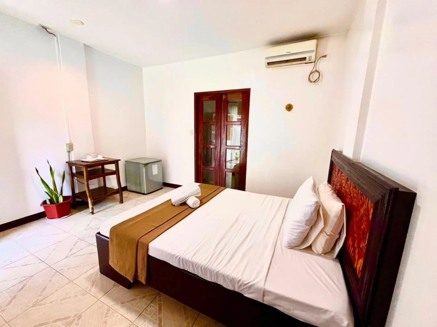 Bed in CHIISAI NATSU RESORT