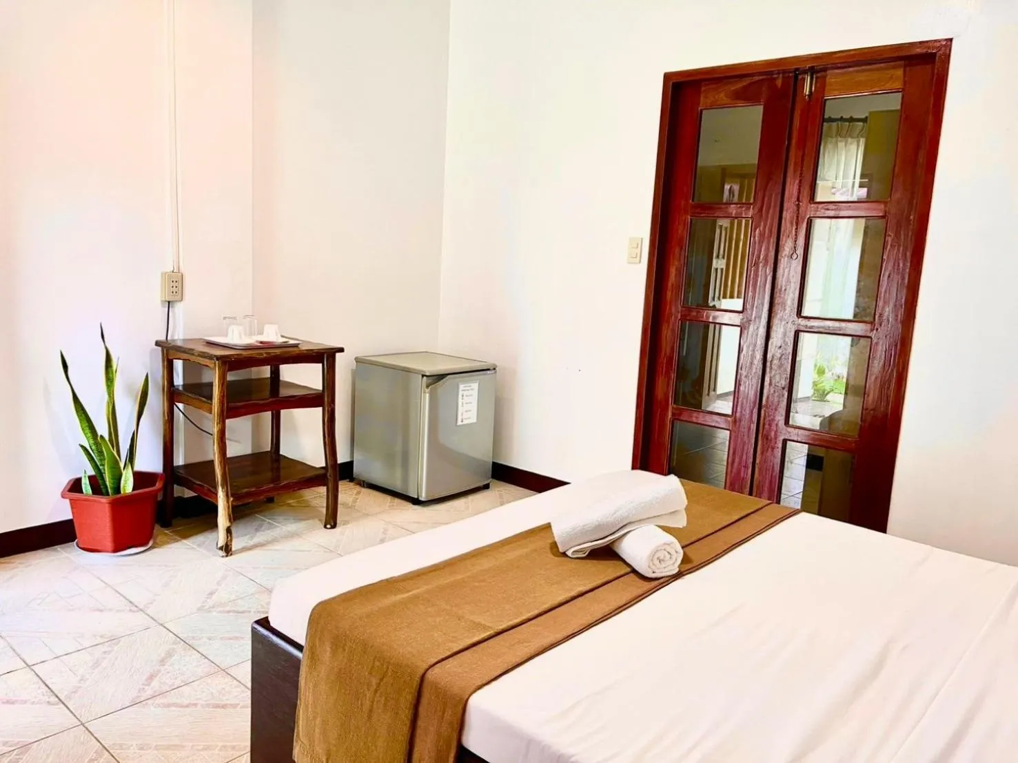 Bed in CHIISAI NATSU RESORT