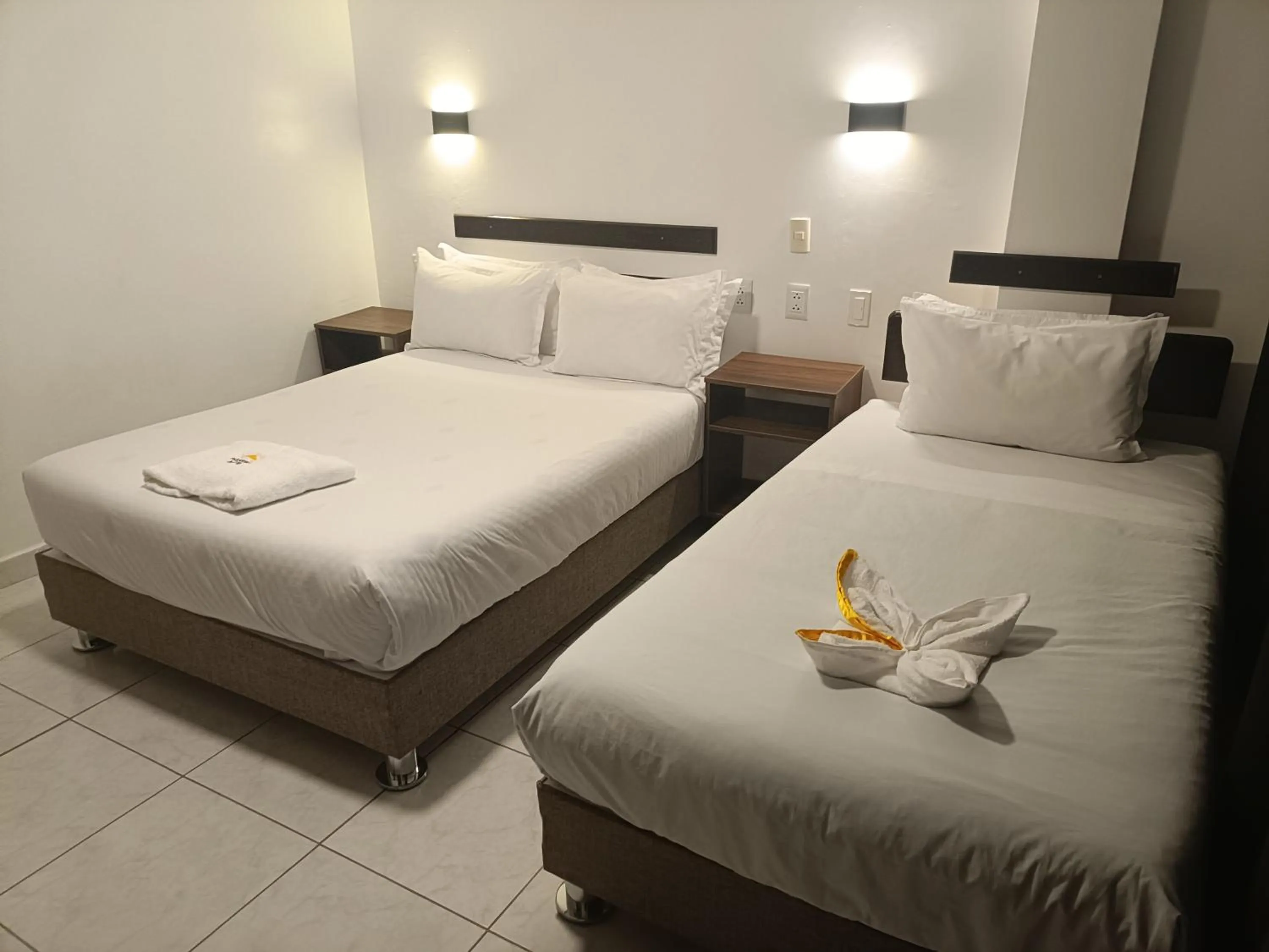 Bed in PAKARINA HOTEL