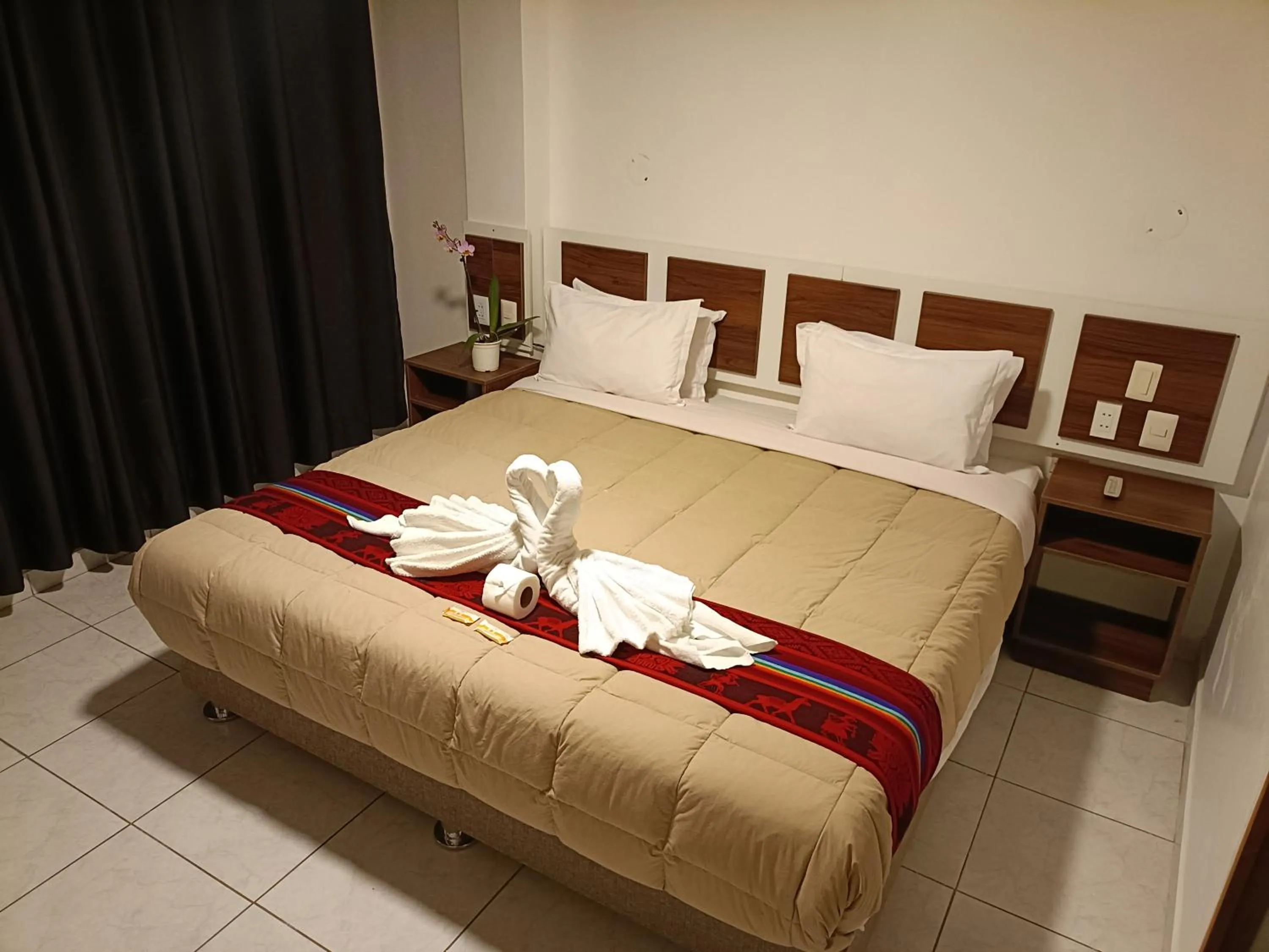 Bed in PAKARINA HOTEL