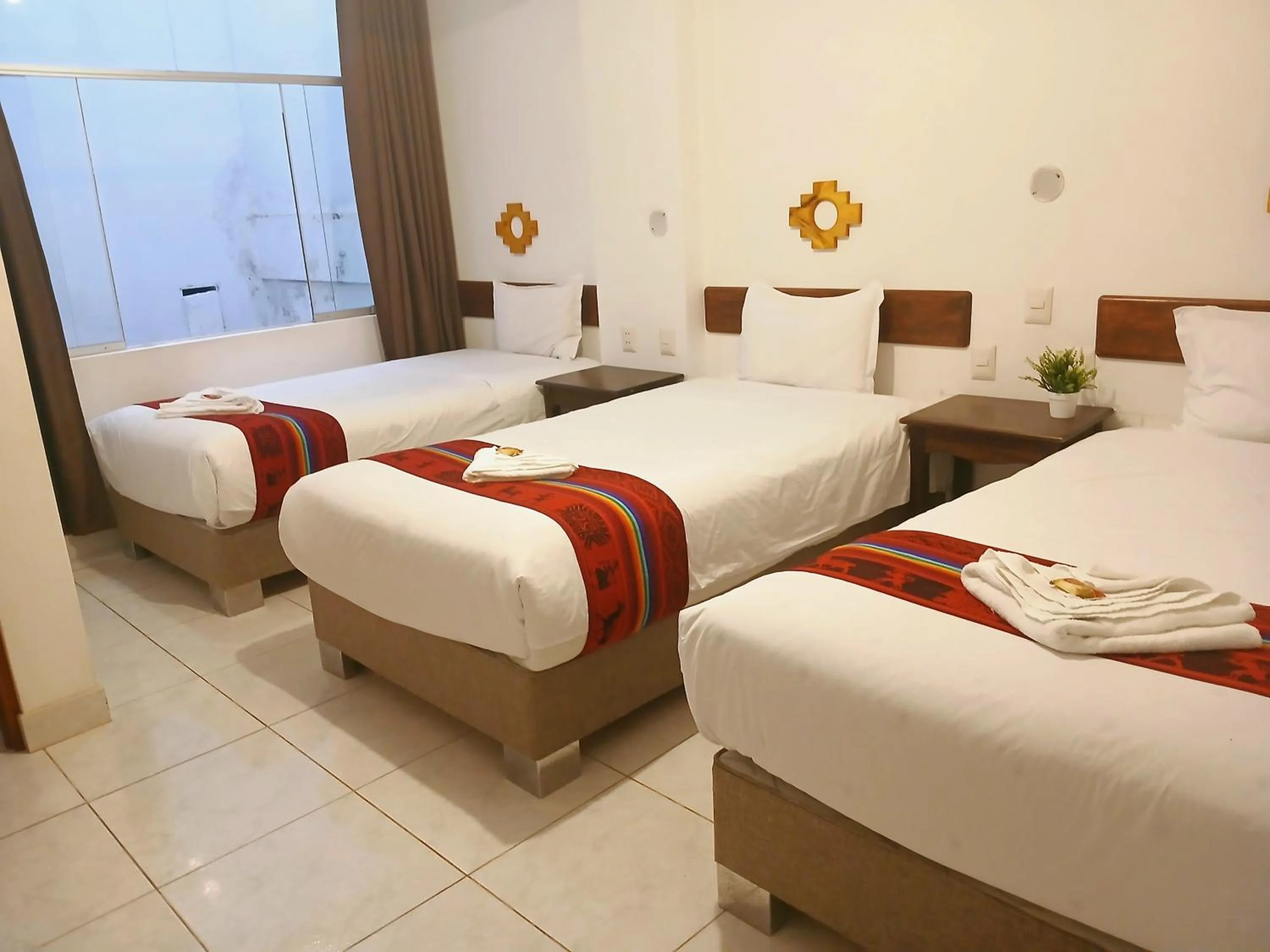 Bed in PAKARINA HOTEL