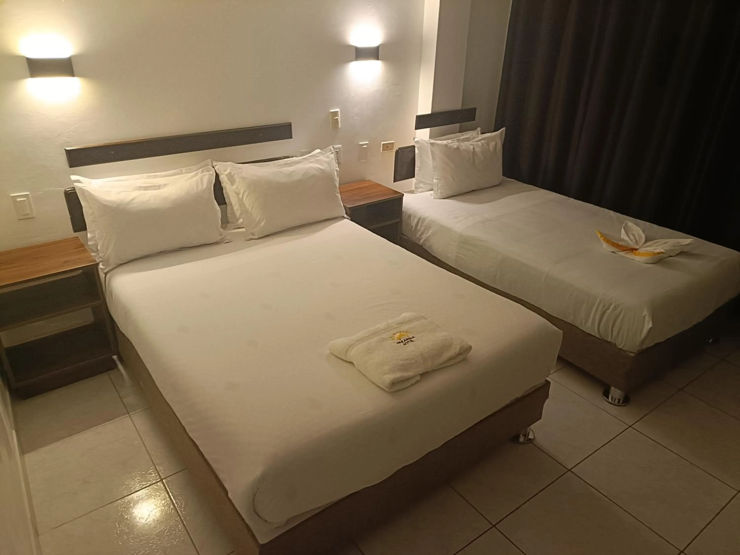 Bed in PAKARINA HOTEL