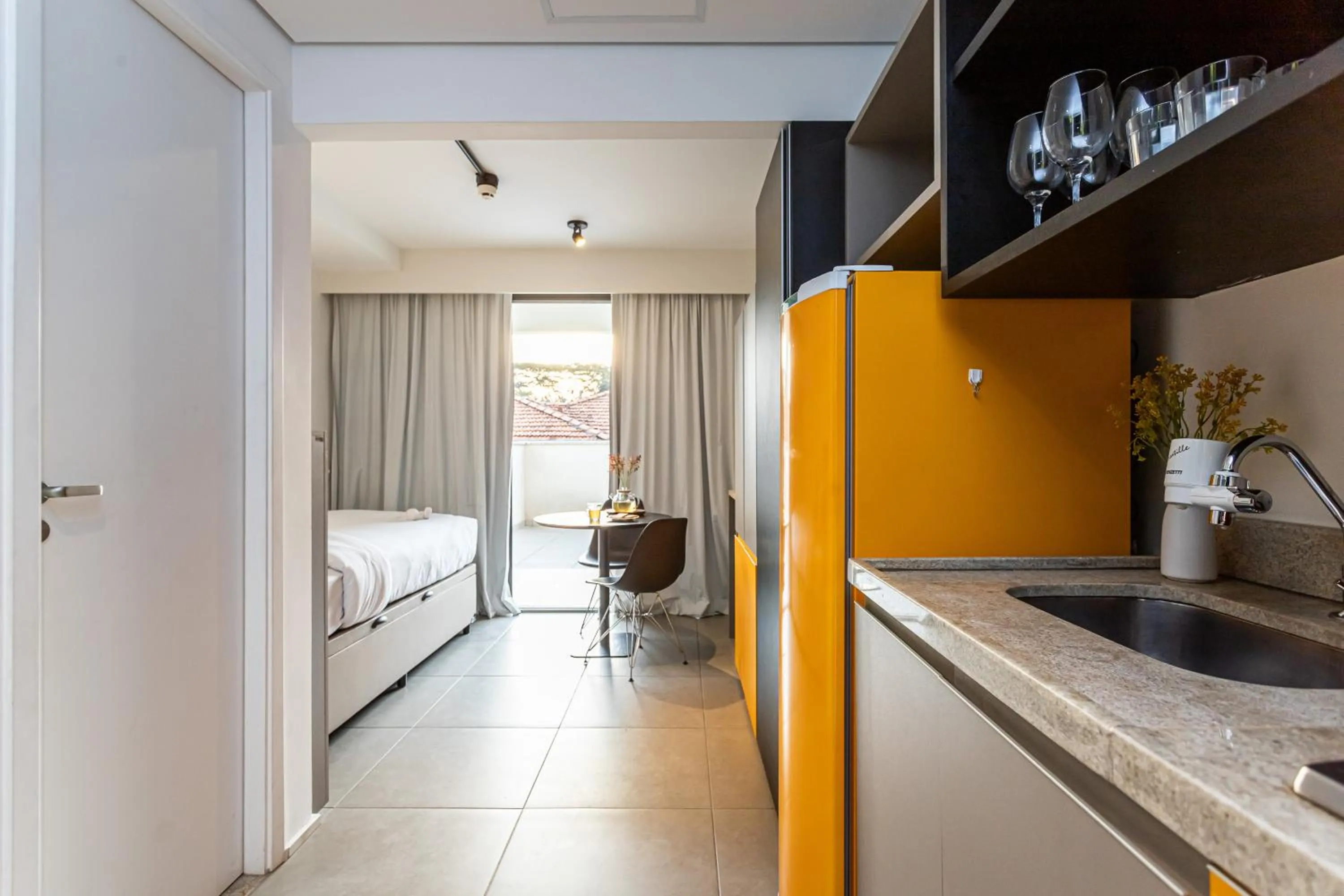 Kitchen or kitchenette, Bed in KASA by Viva - Prédio completo ao lado da Faria Lima