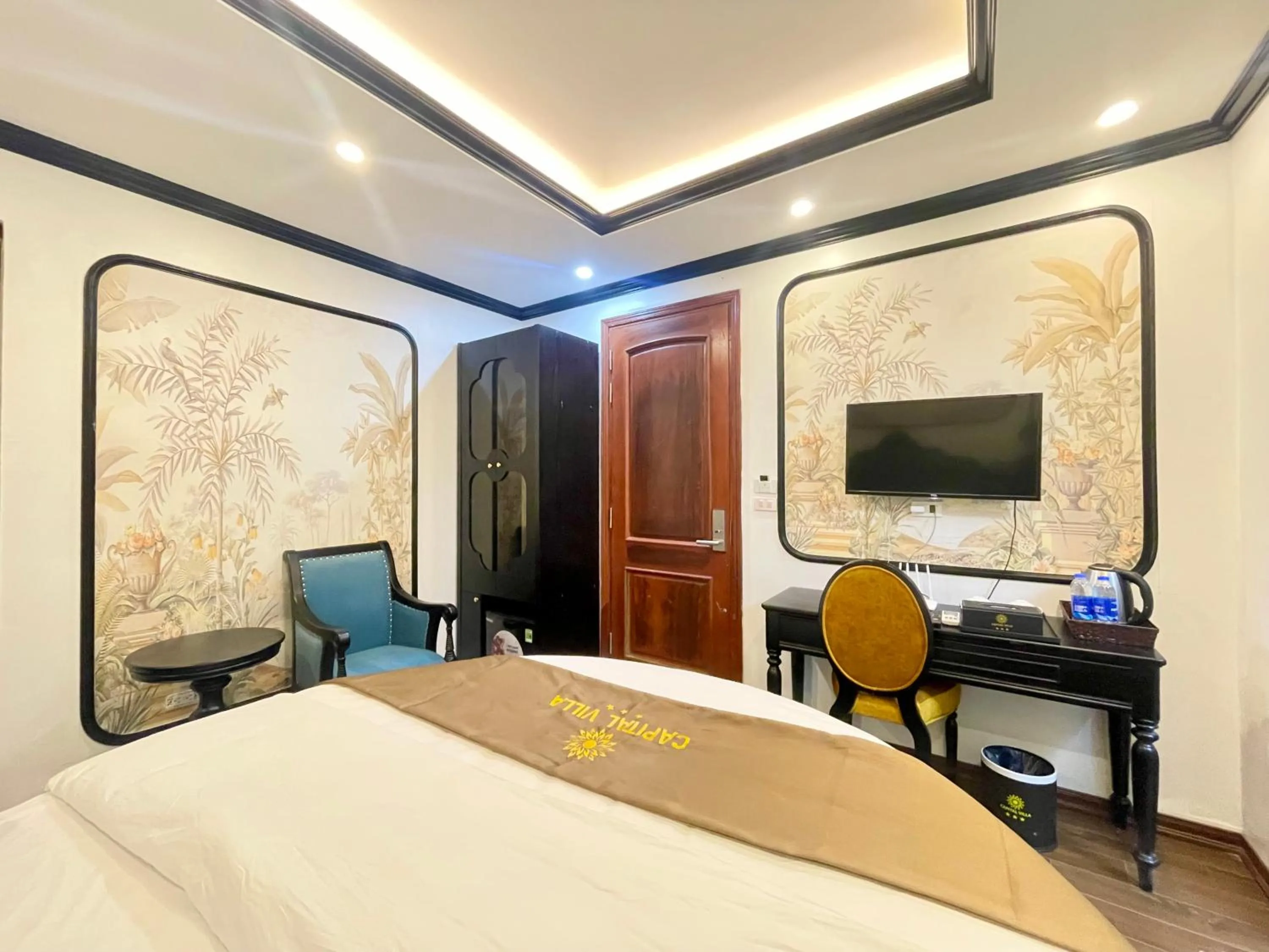 Communal lounge/ TV room, Bed in Capital CauGiay Hotel