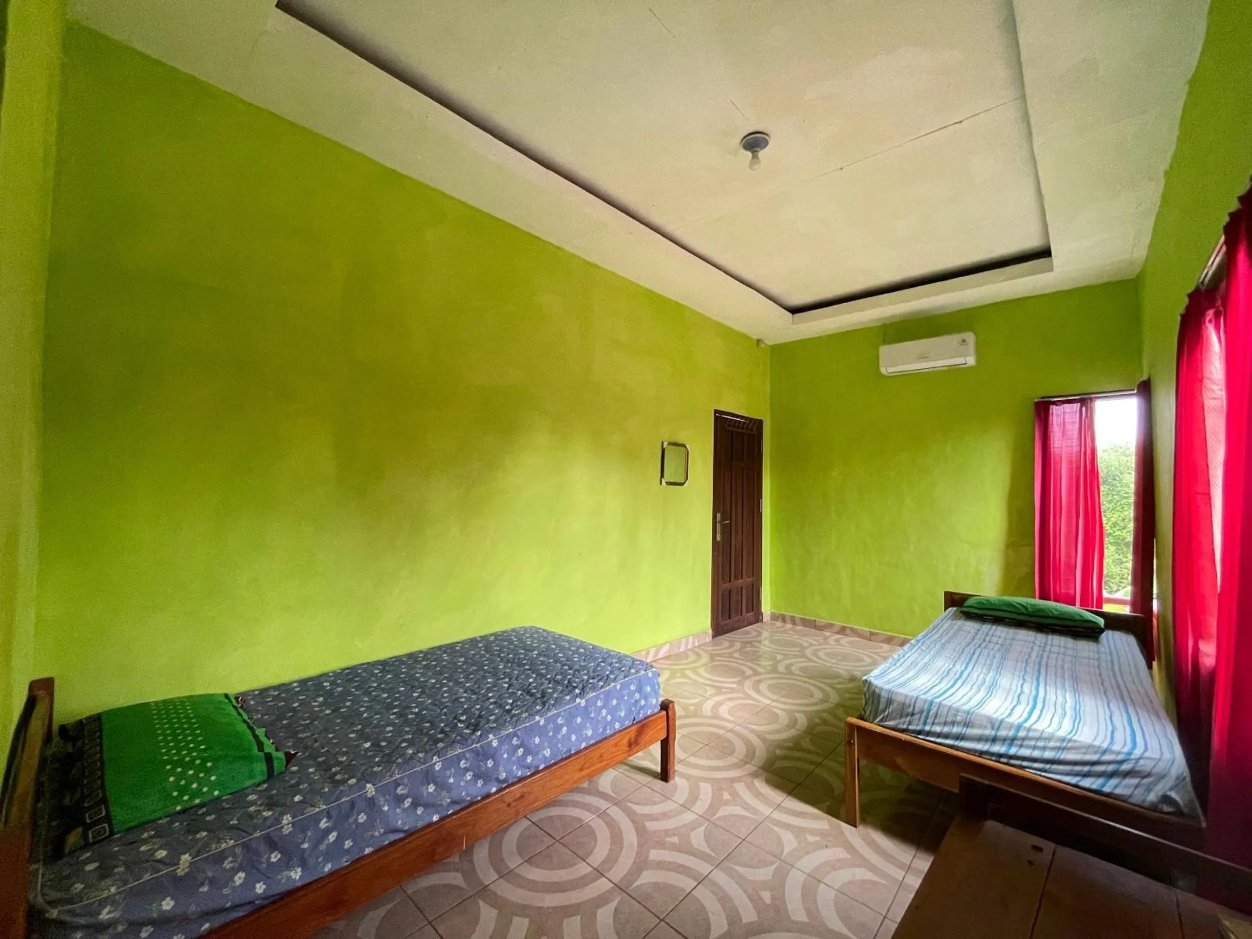 Bedroom in Hotel O Penginapan Asoka Indah Near PT. PLN (persero) Gardu Induk Barru