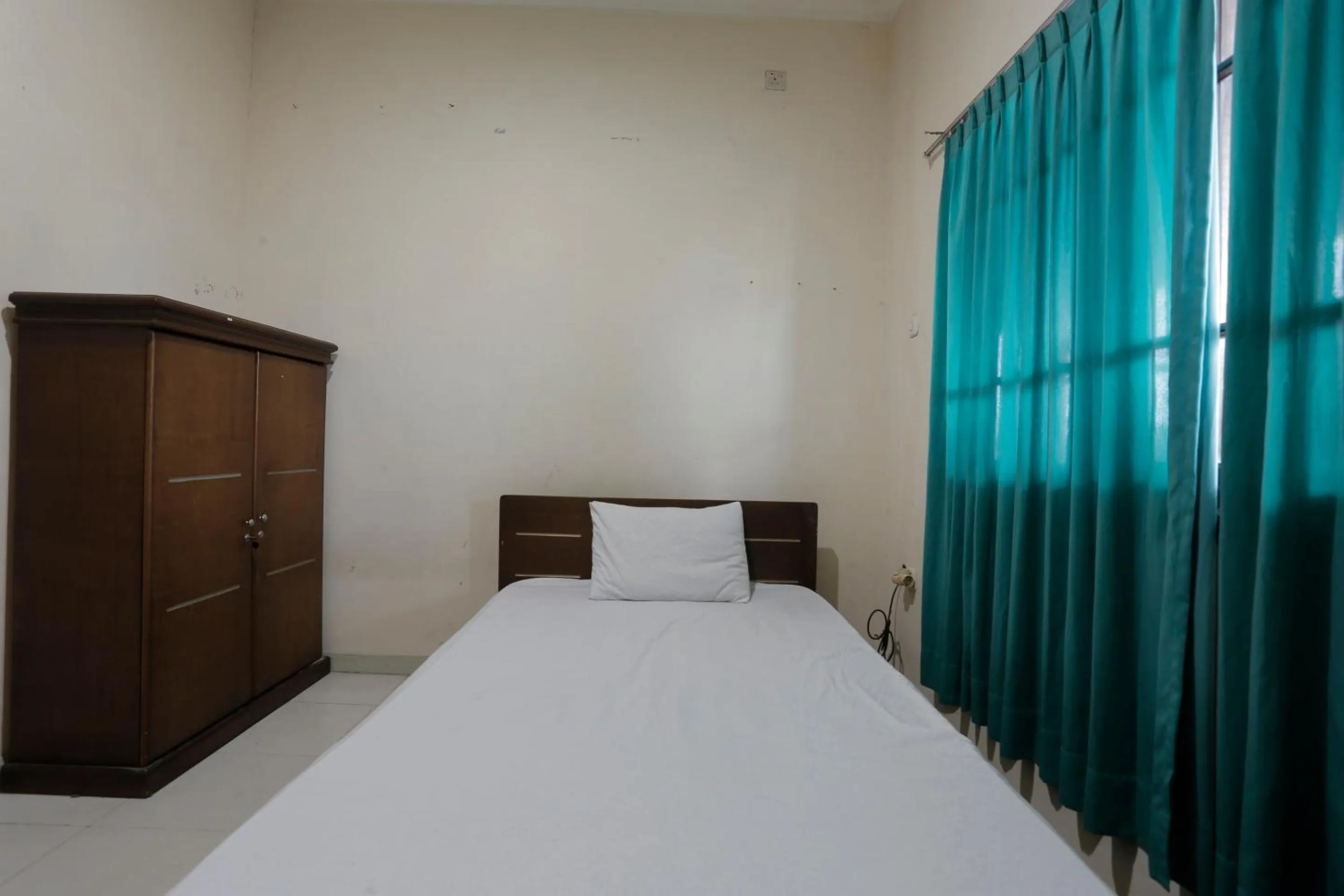 Bedroom in Hotel O Rumah Kost Kita Tarakan