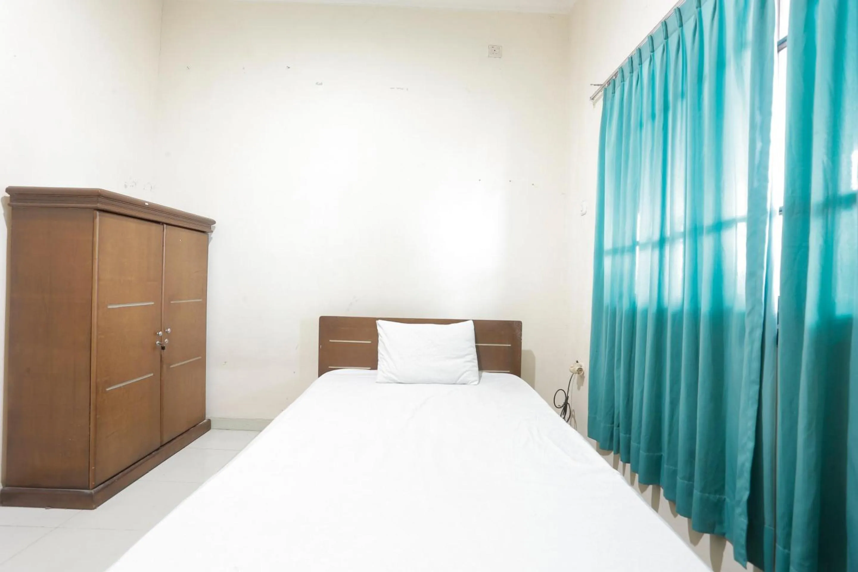 Bedroom in Hotel O Rumah Kost Kita Tarakan
