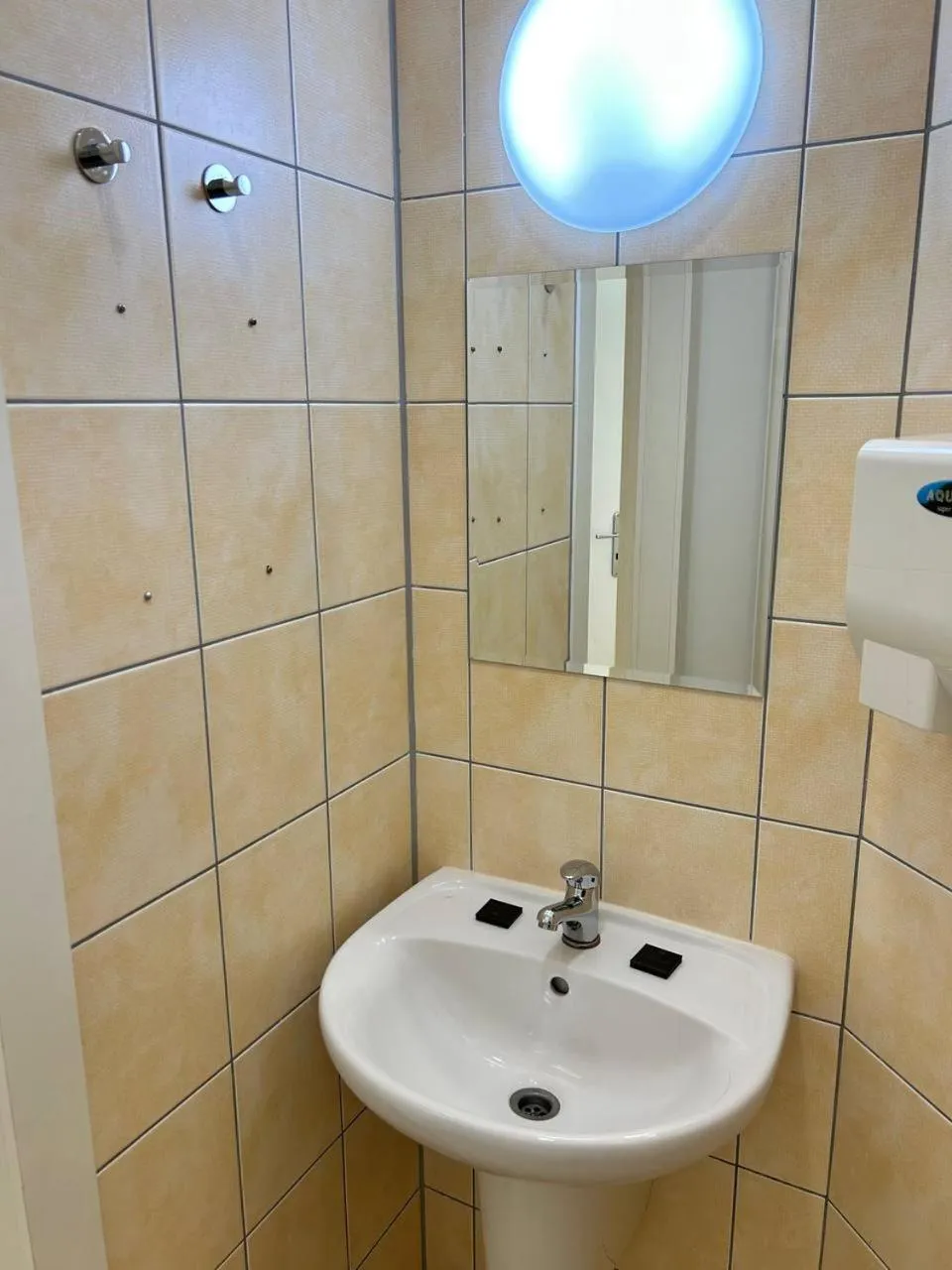 Toilet in Powder Tower Suites