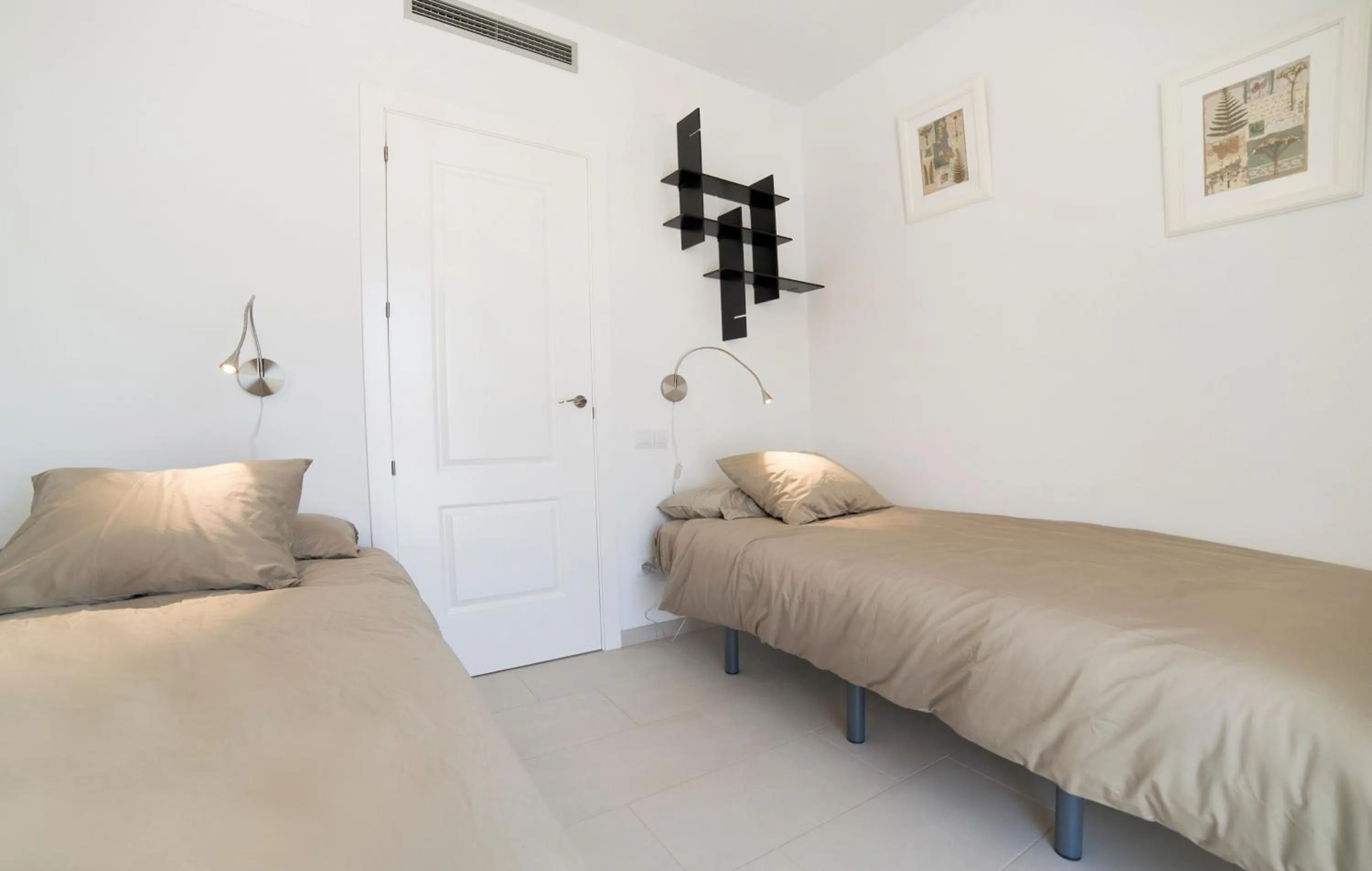 Bed in Modern Duplex in Sitges with Private Parking, Sea Views & Terrace