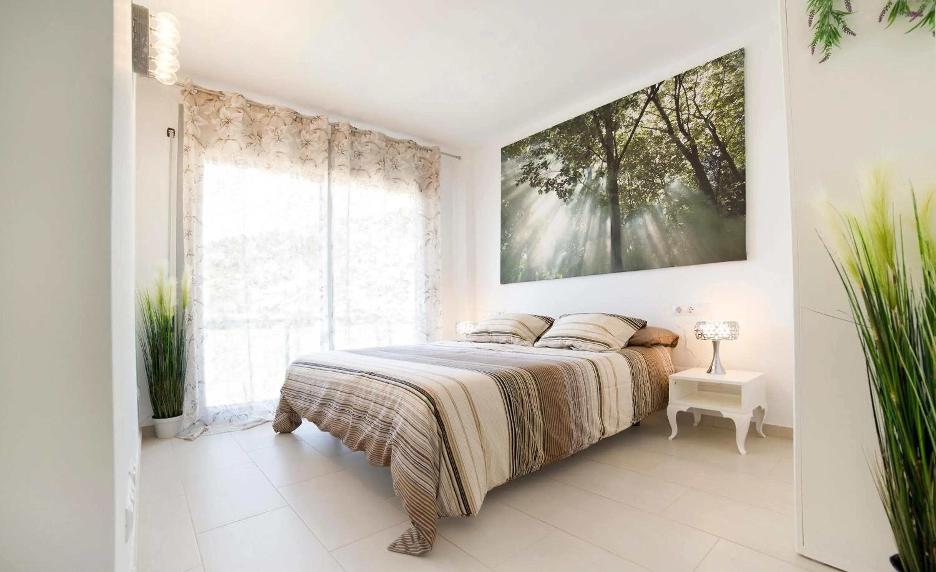 Bed in Modern Duplex in Sitges with Private Parking, Sea Views & Terrace