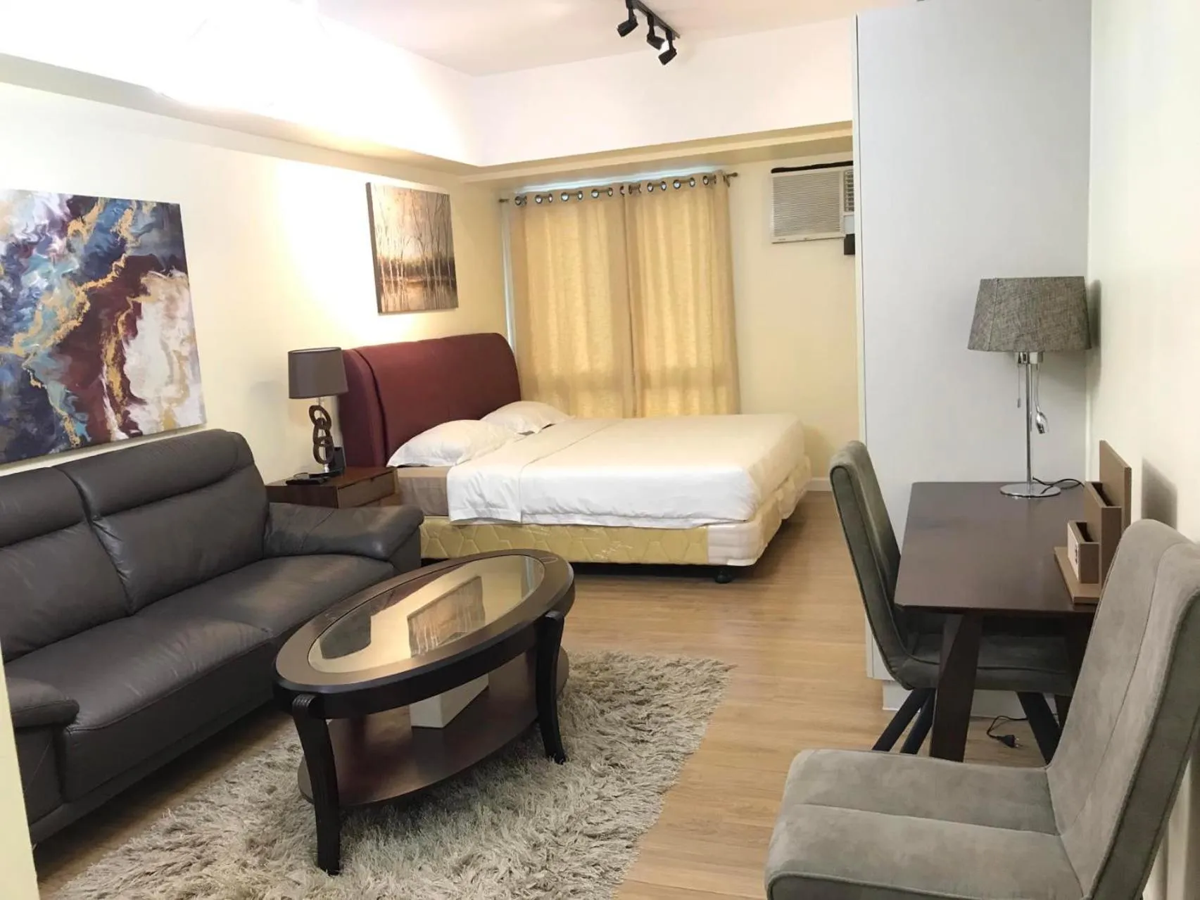 Seating area, Bed in Davao Central Suites