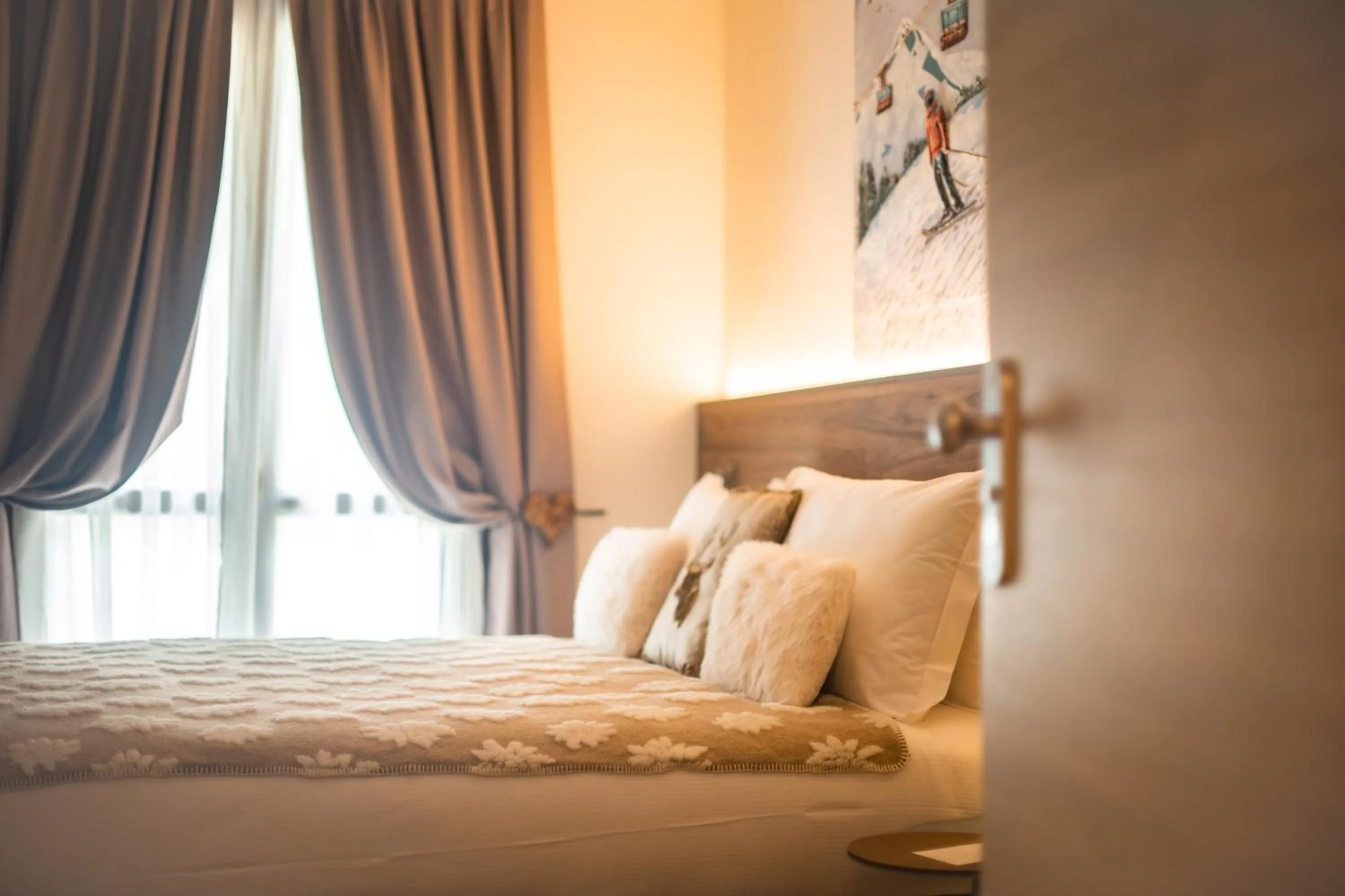 Bed in Maison Poluc hotel apartments