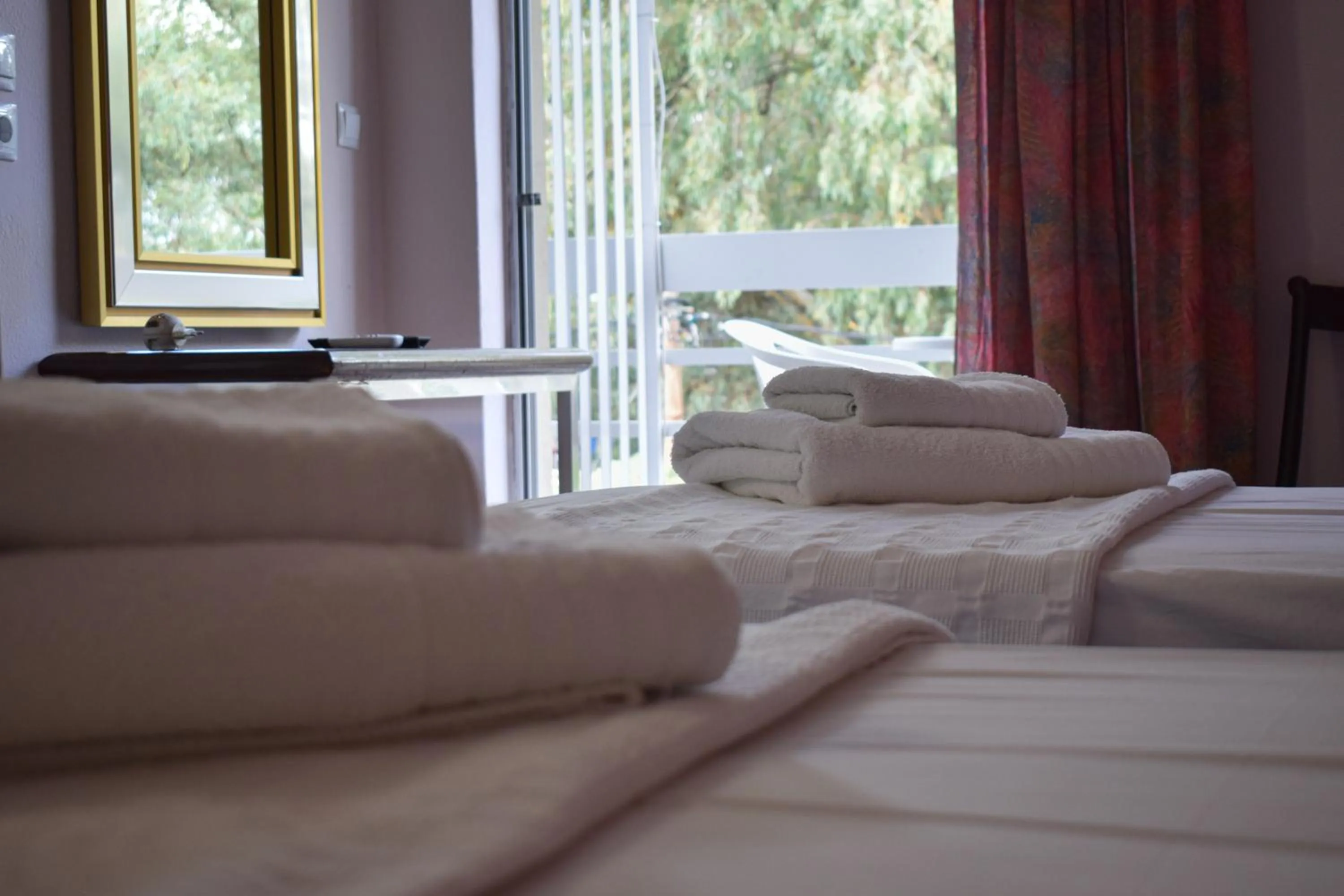 Bed in Hotel Theoxenia