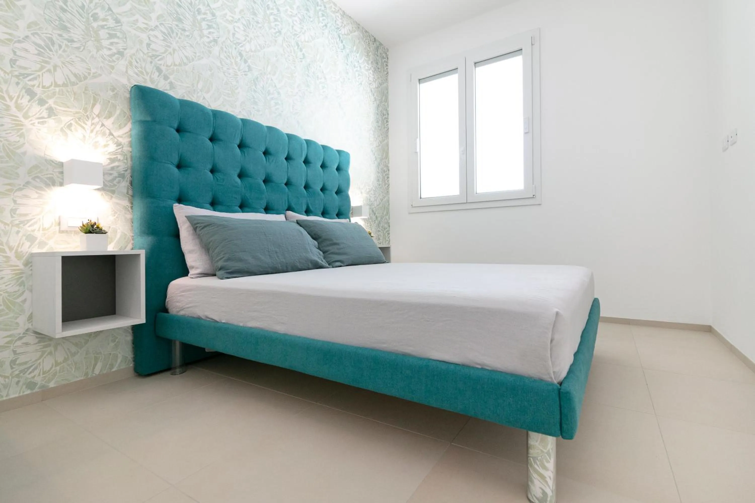 Bed in Stellaris Apartrooms