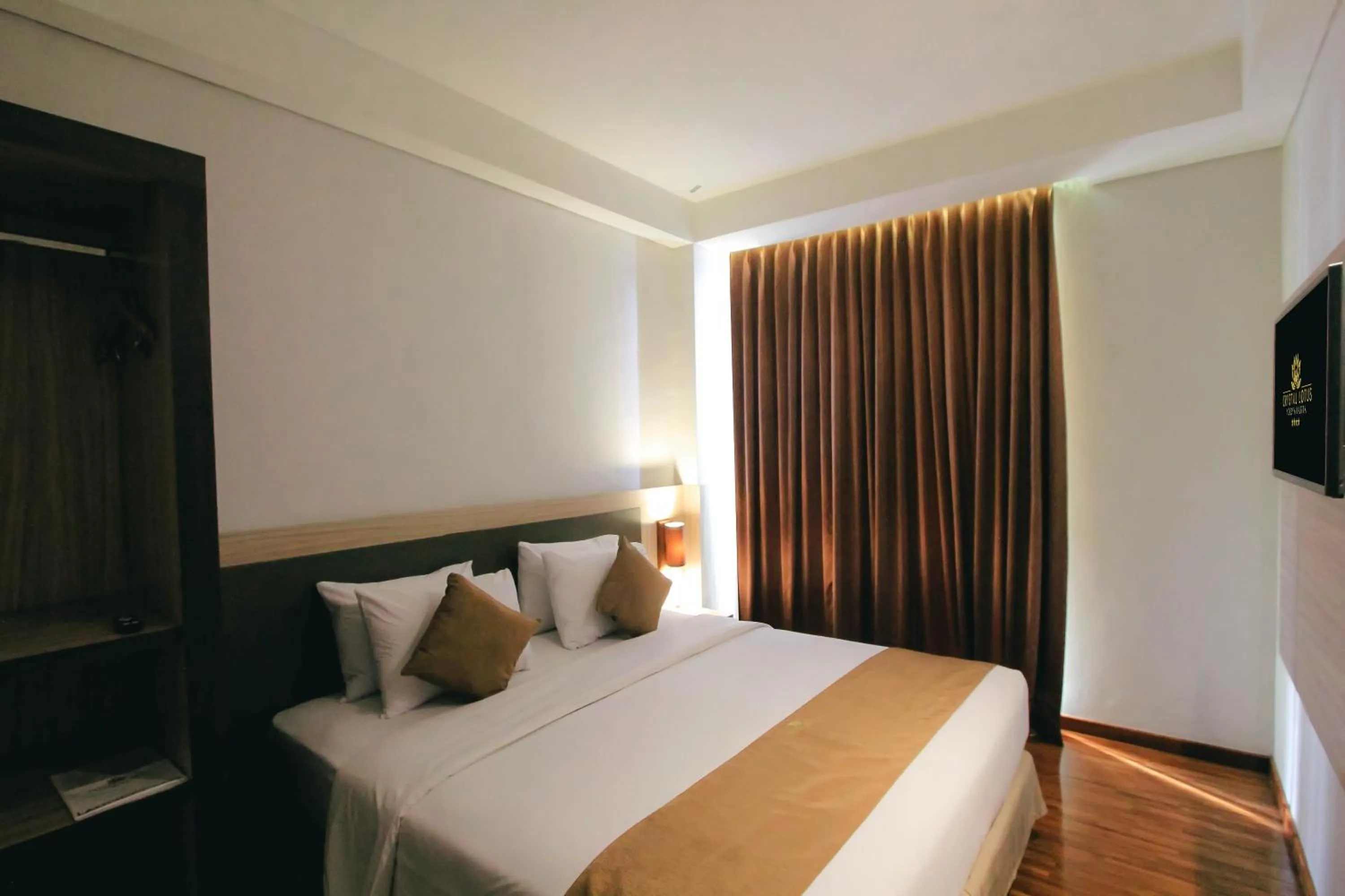 Bed in Crystal Lotus Hotel Yogyakarta