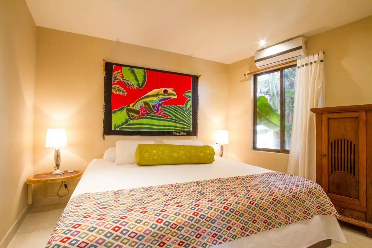 Bed in Tamarindo Village Hotel