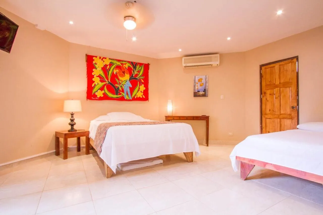 Bed in Tamarindo Village Hotel