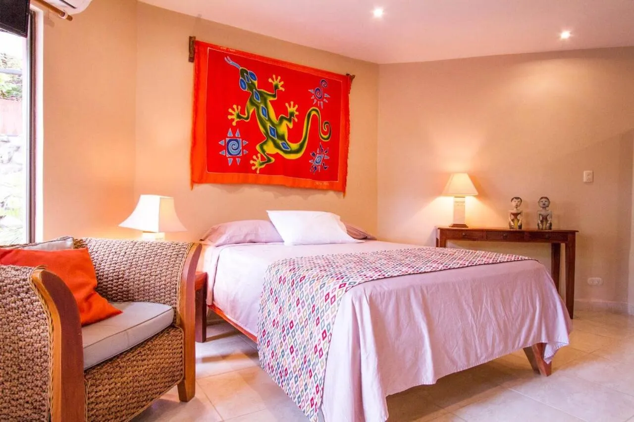 Bed in Tamarindo Village Hotel
