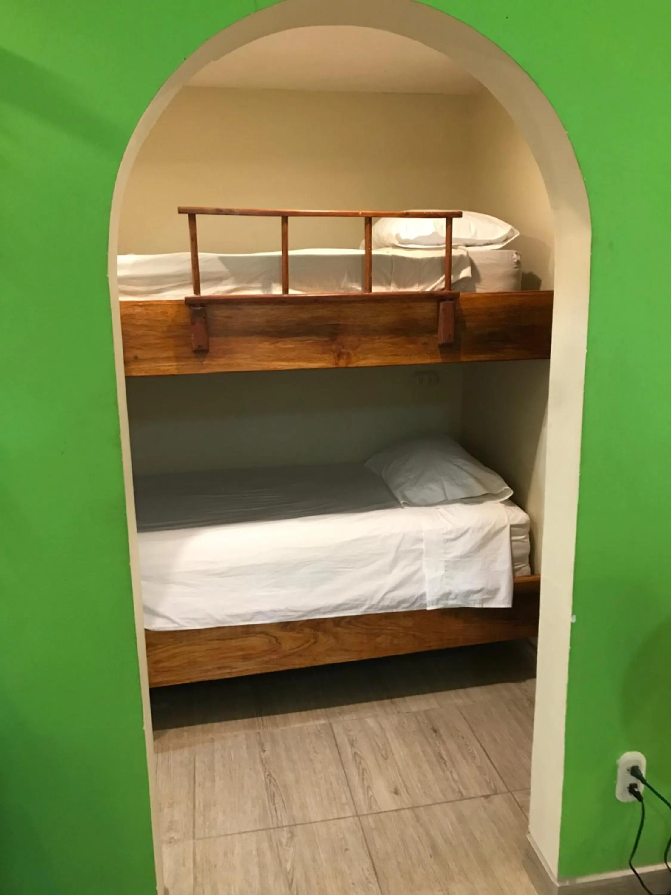 Bed in Tamarindo Village Hotel