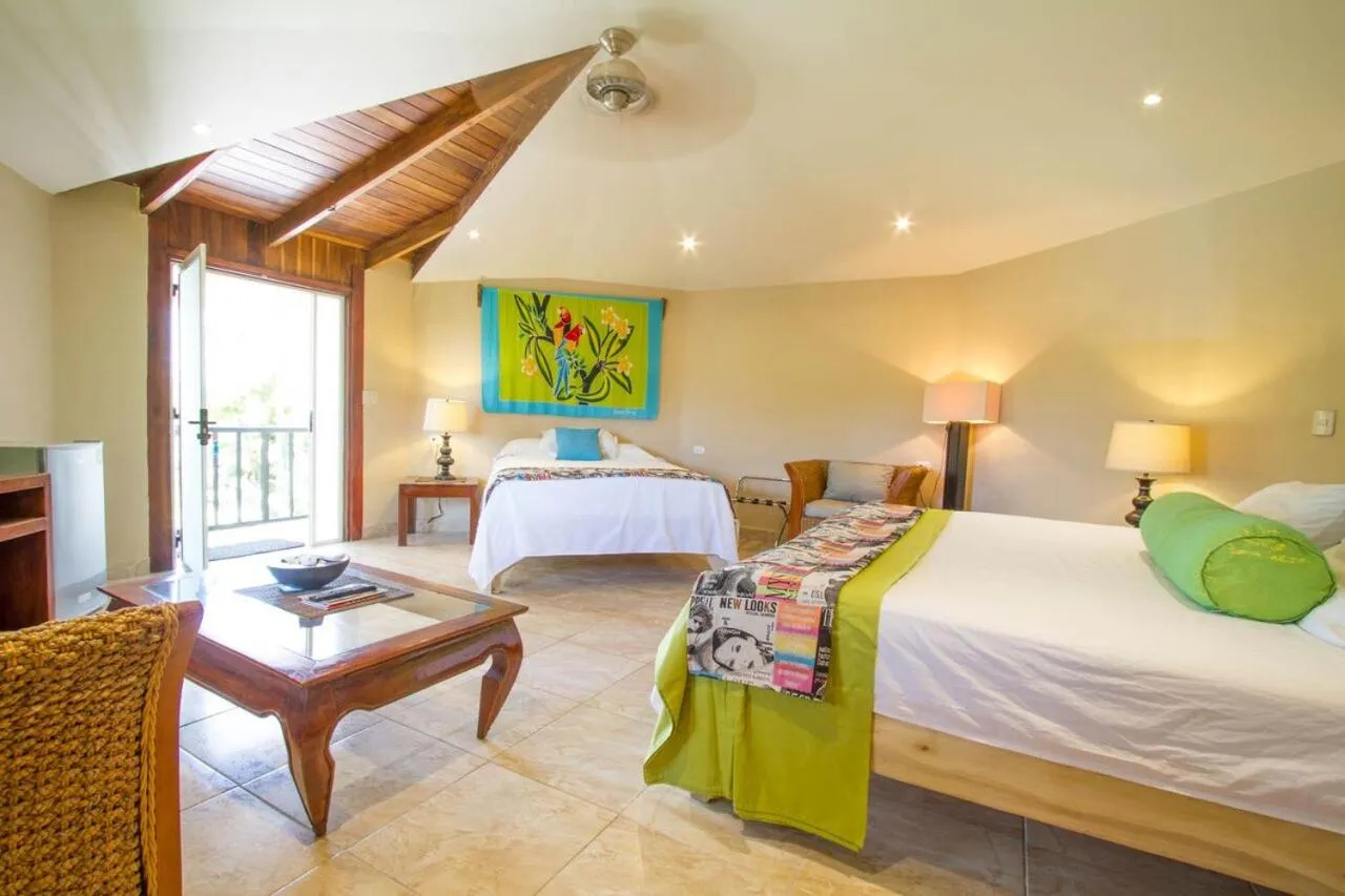 Bed in Tamarindo Village Hotel