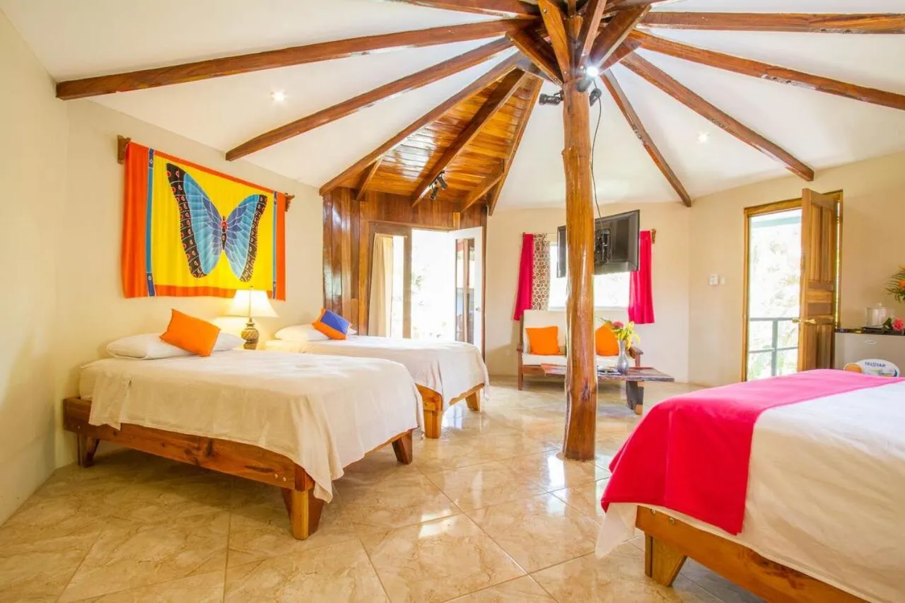 Bed in Tamarindo Village Hotel