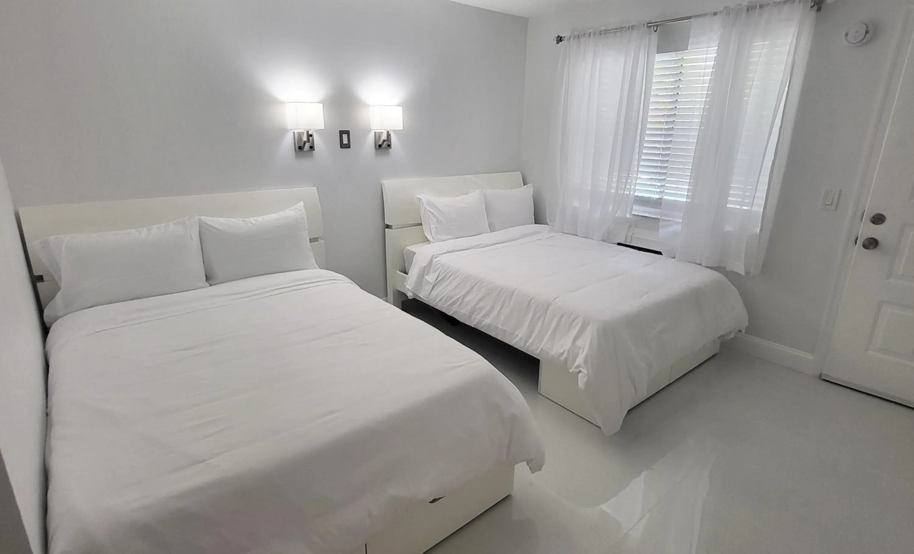 Bed in Palm Breeze Hotel