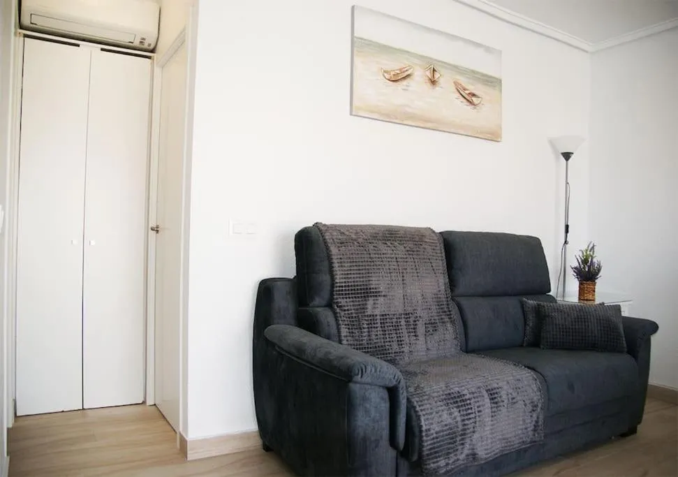 Living room in Bungalow frente la playa Cala Capitan ,#PRP002 by Stay Orihuela Costa