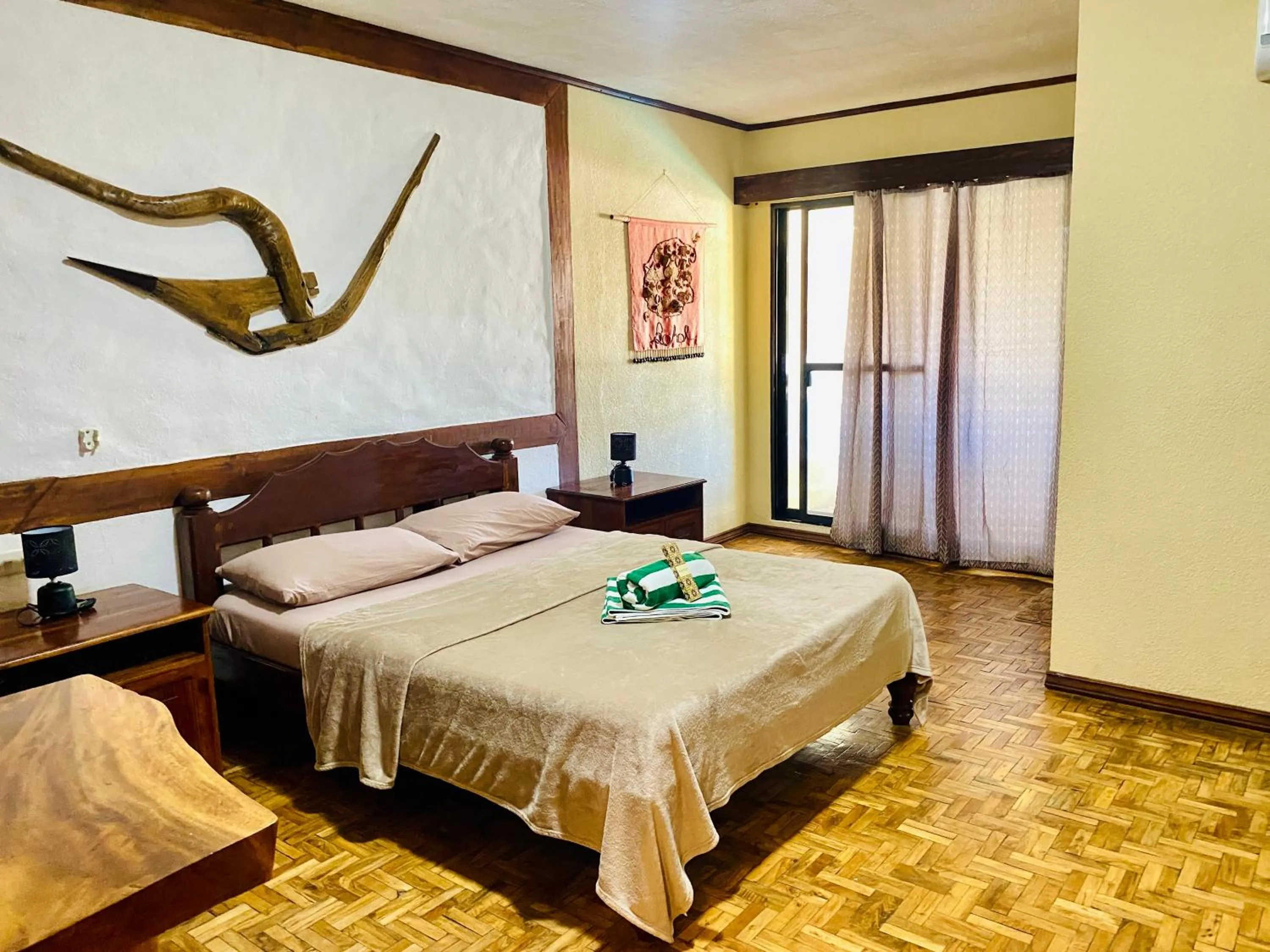 Bed in TipTop Hotel, Resto and Delishop