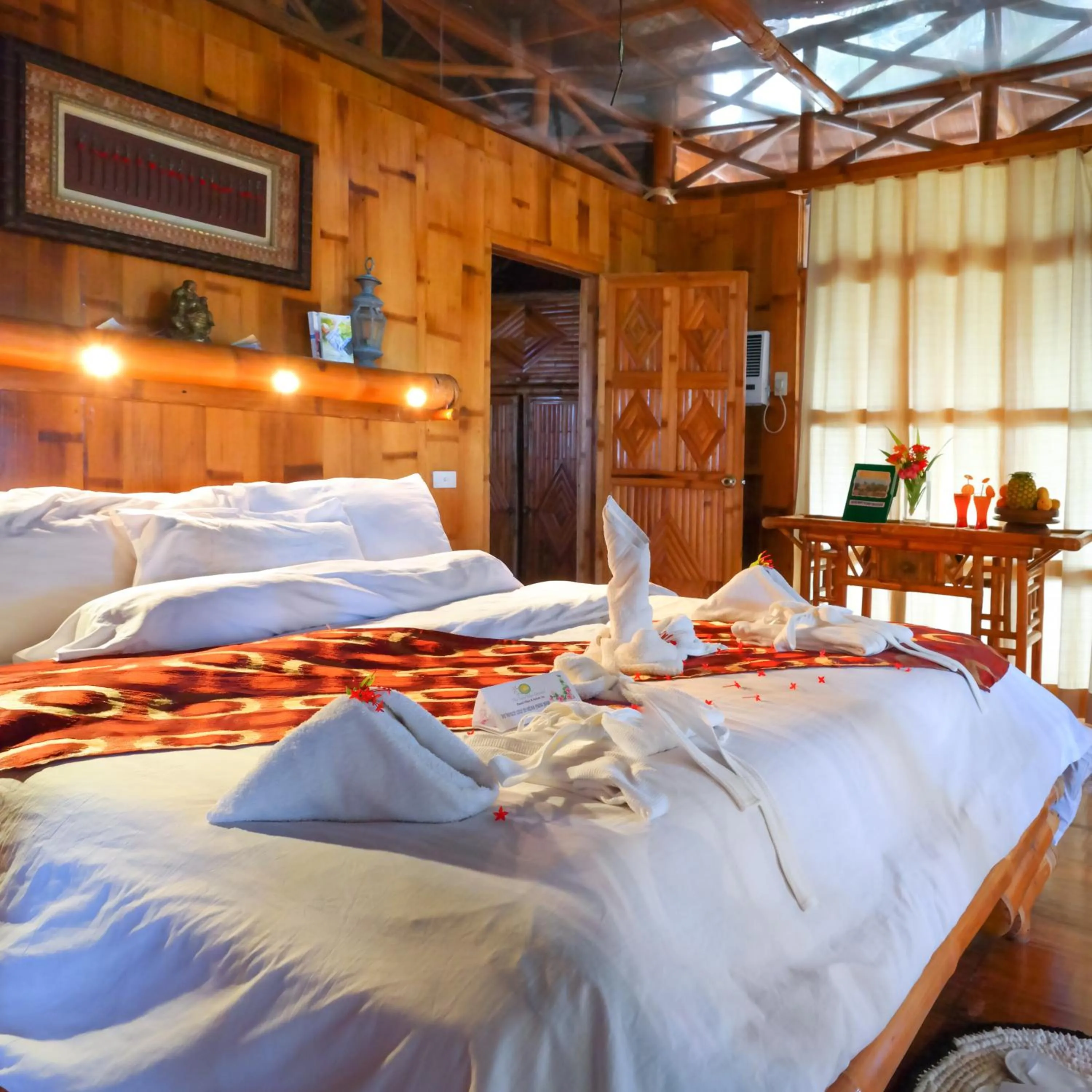 Bed in The Coral Blue Oriental Beach Villas and Suites