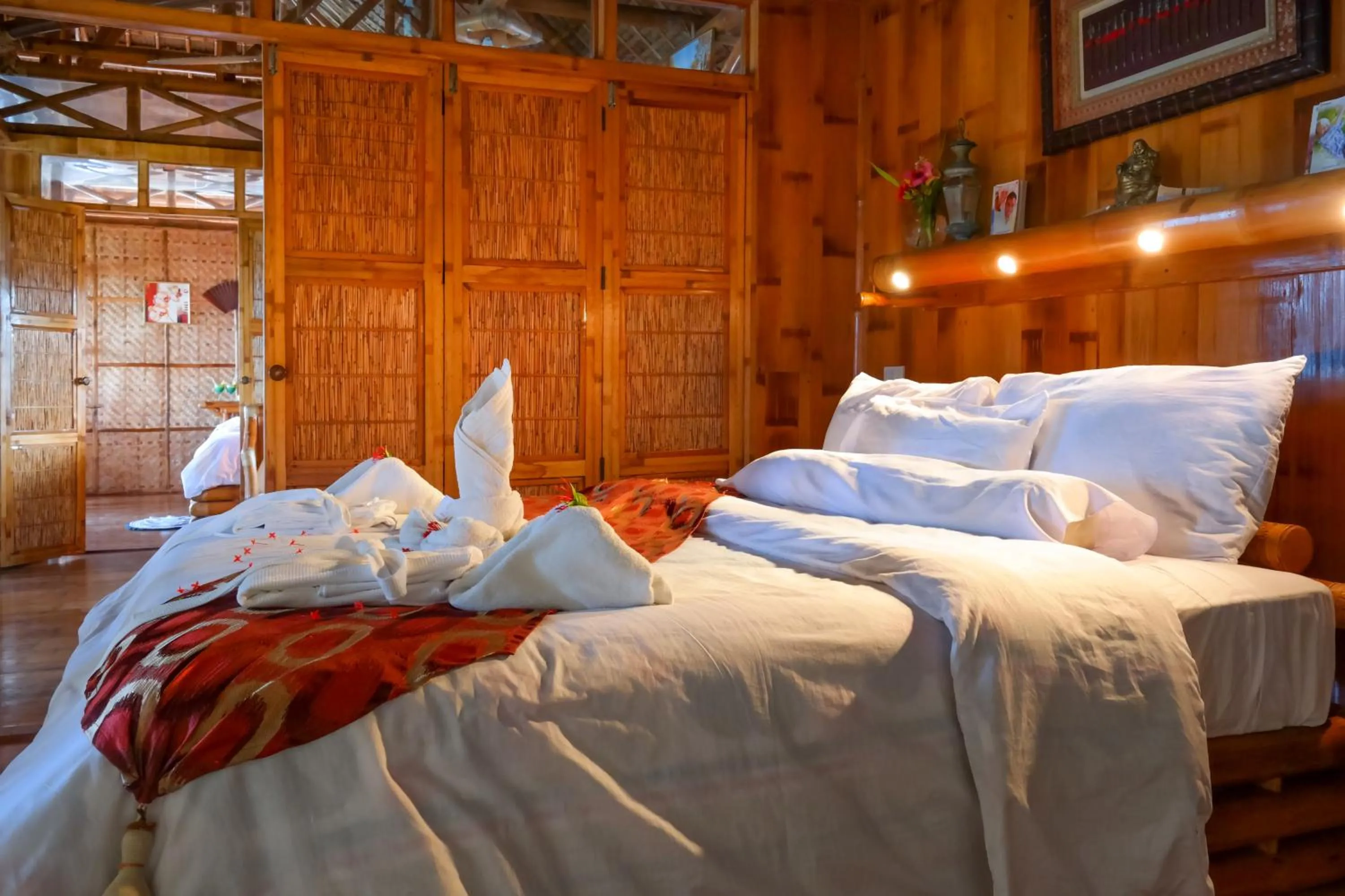 Photo of the whole room, Bed in The Coral Blue Oriental Beach Villas and Suites