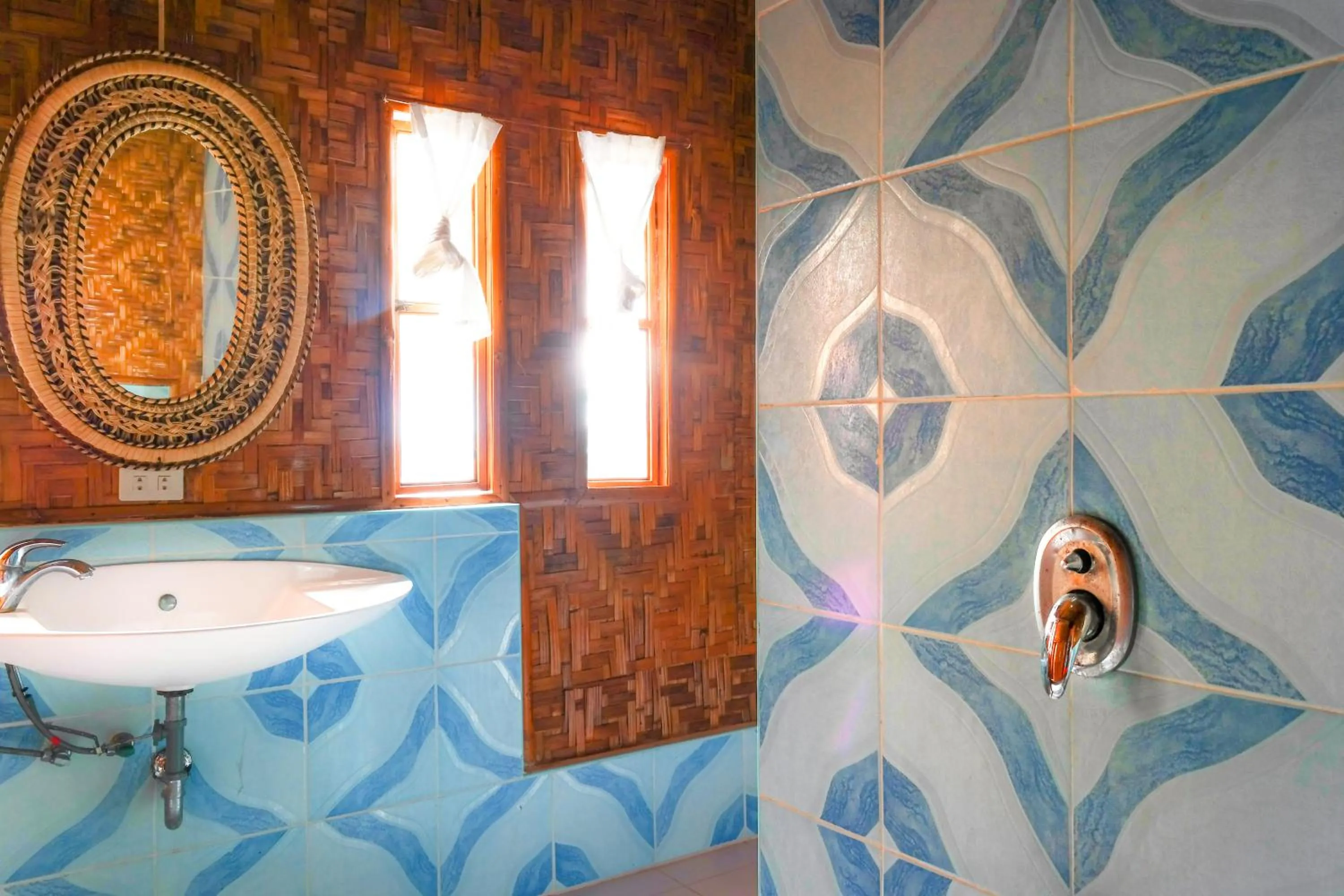 Bathroom in The Coral Blue Oriental Beach Villas and Suites