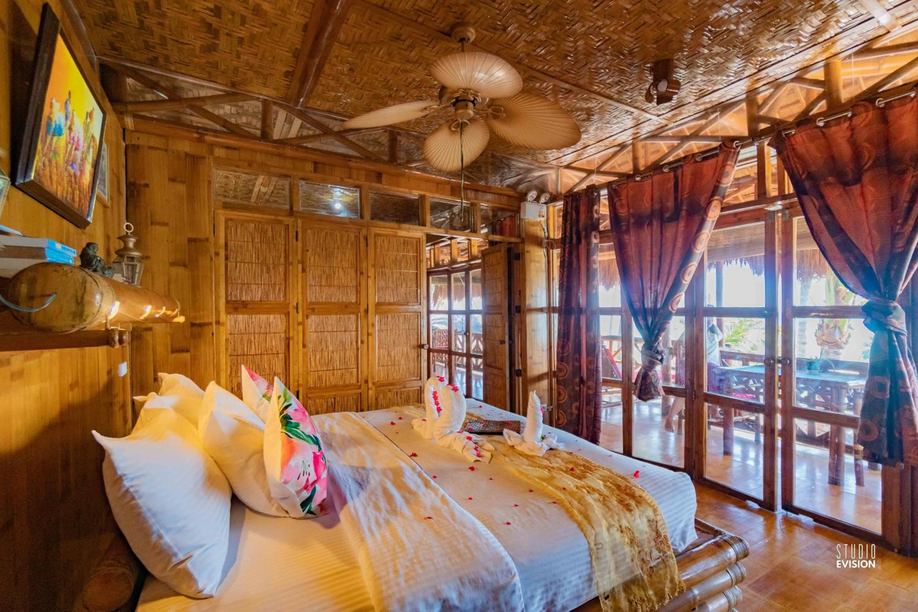 Bed in The Coral Blue Oriental Beach Villas and Suites