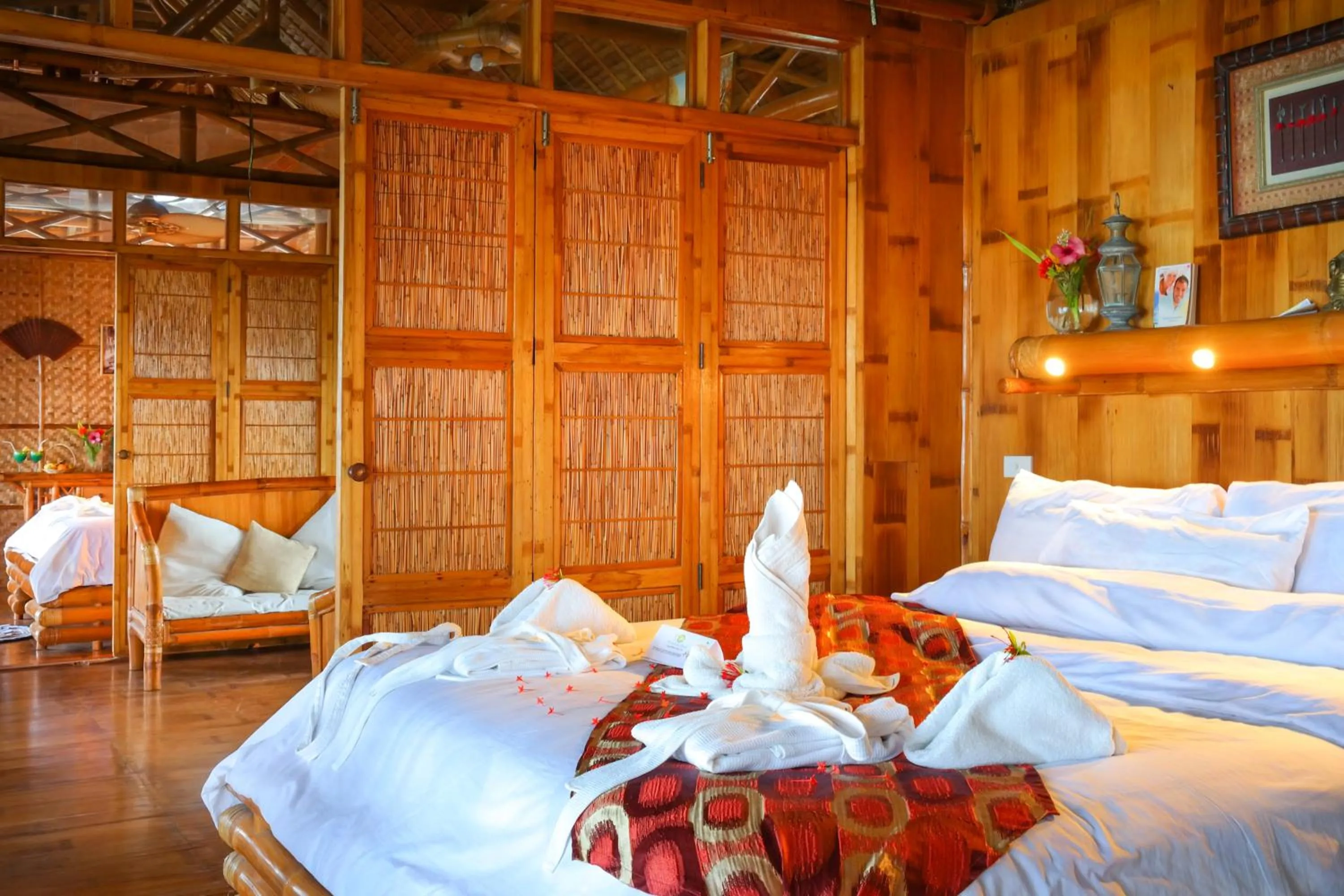 Photo of the whole room, Bed in The Coral Blue Oriental Beach Villas and Suites