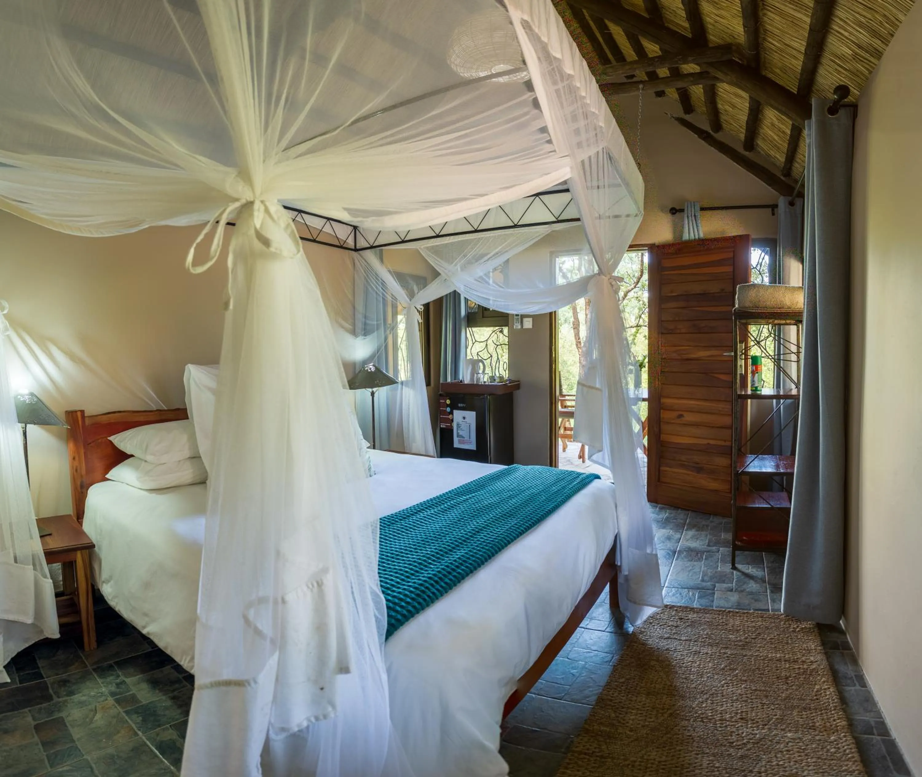 Bed in Maramba River Lodge