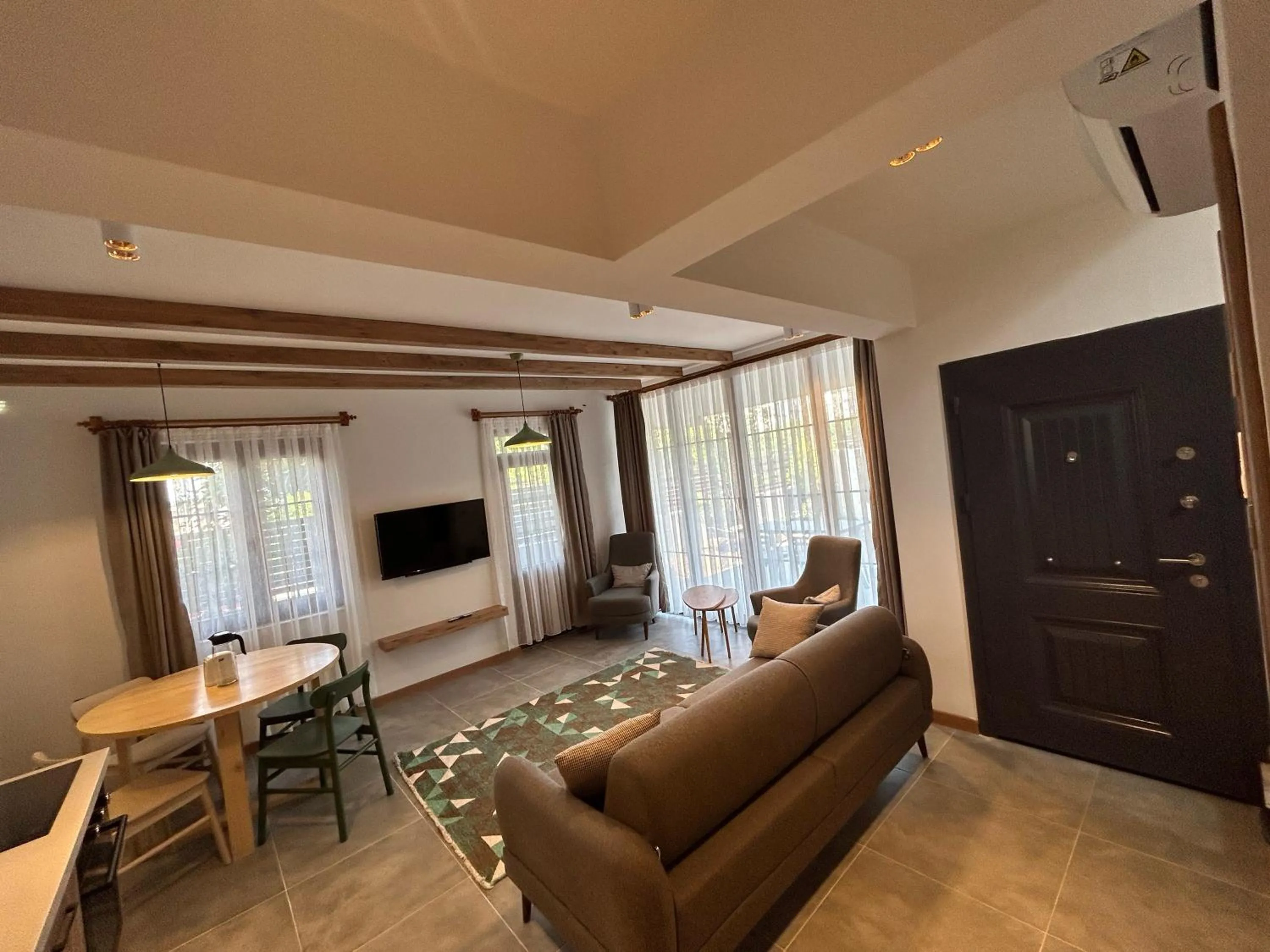 Communal lounge/ TV room in Avlu Villas & Apartments