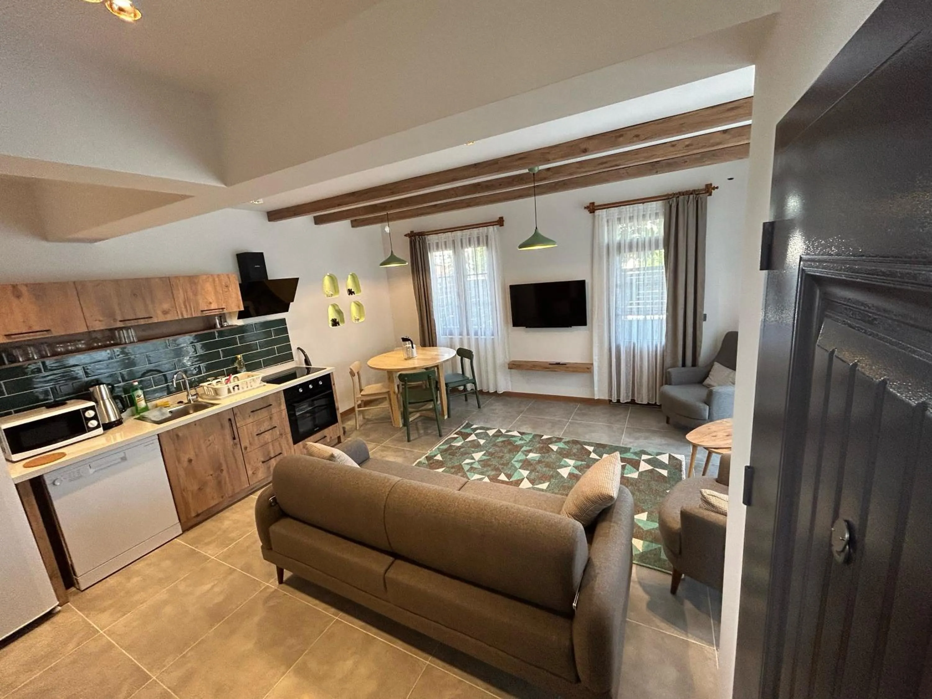 Communal lounge/ TV room in Avlu Villas & Apartments