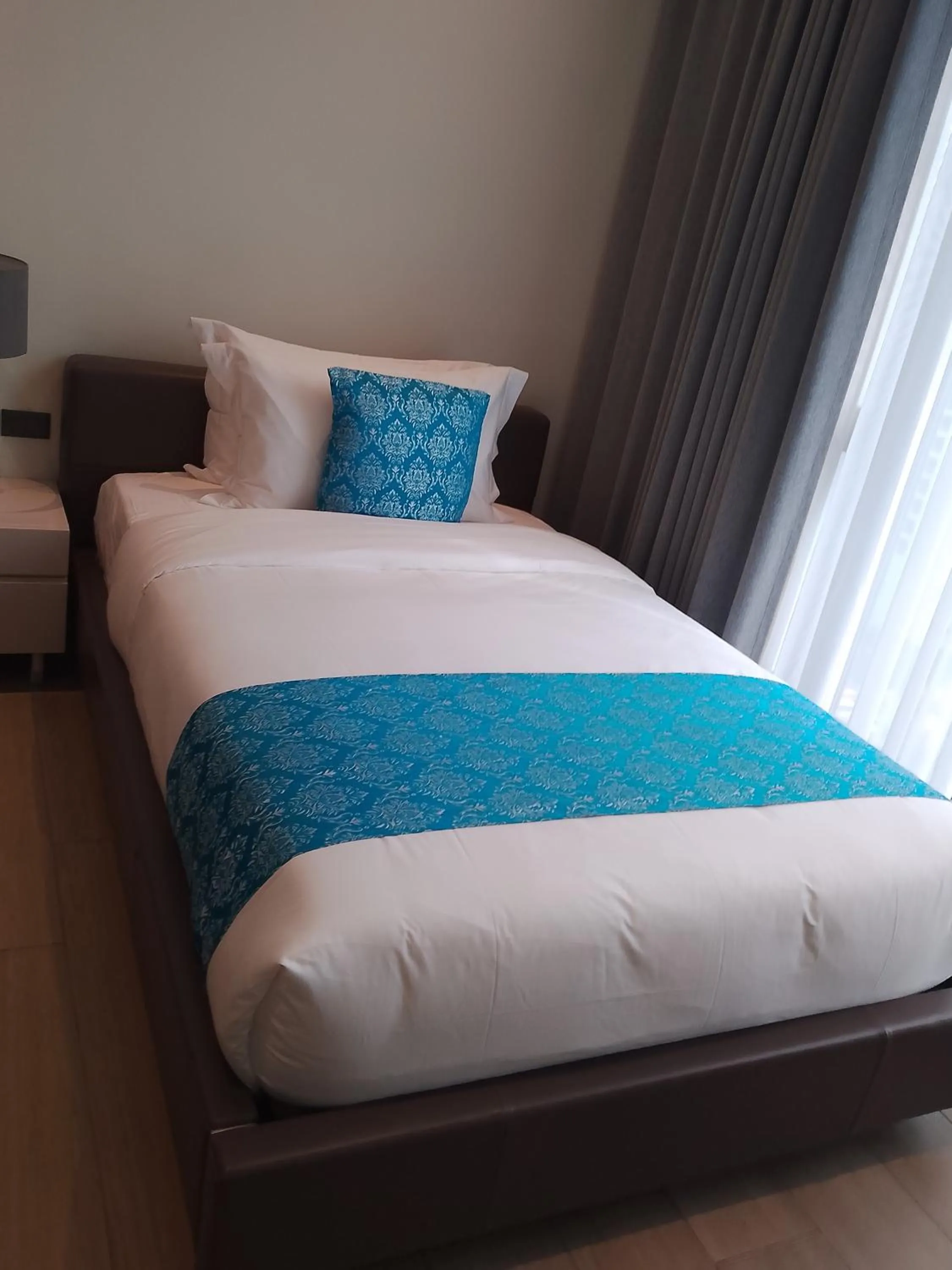 Bed in Bayprime Hotel
