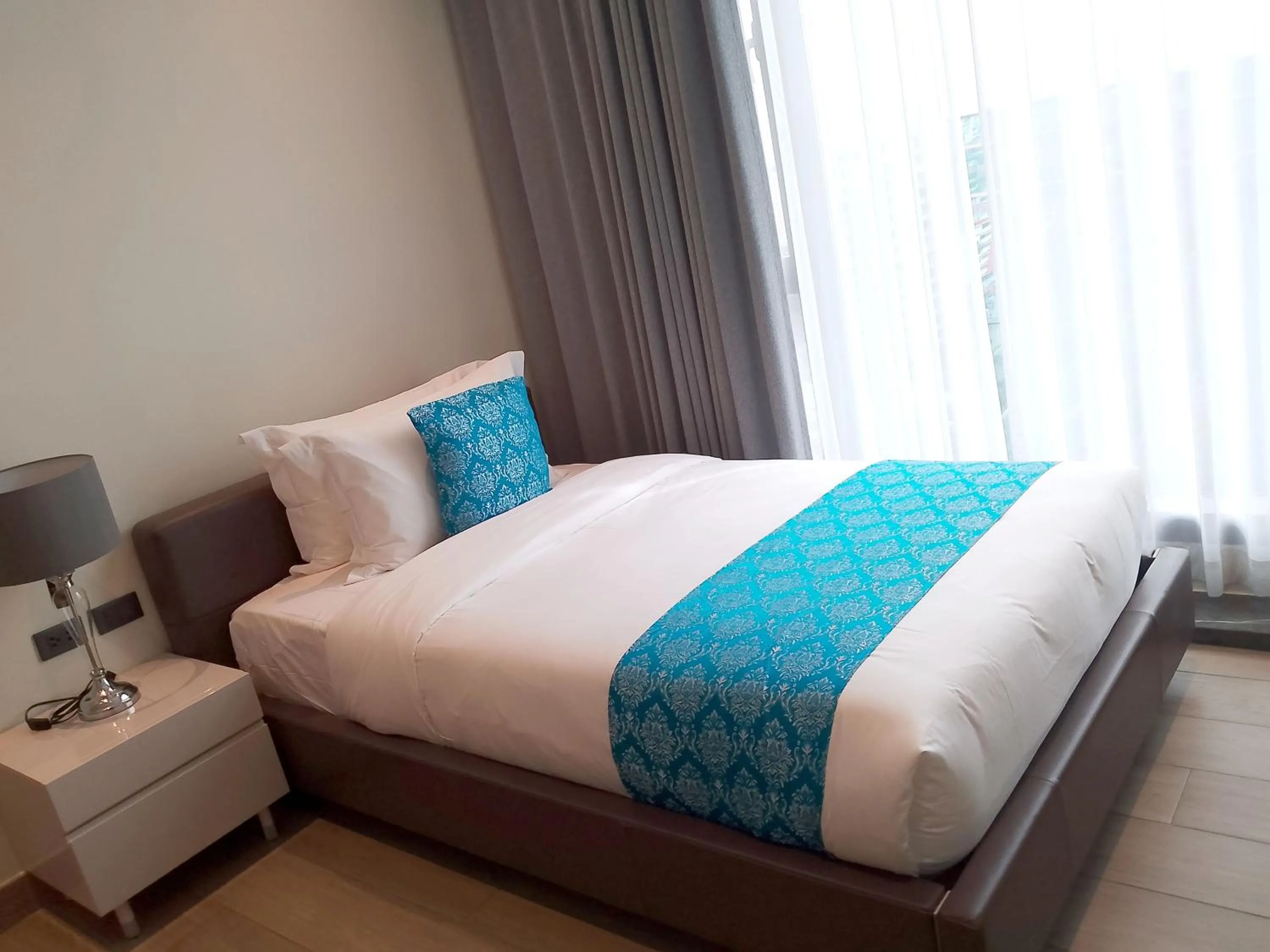 Bed in Bayprime Hotel