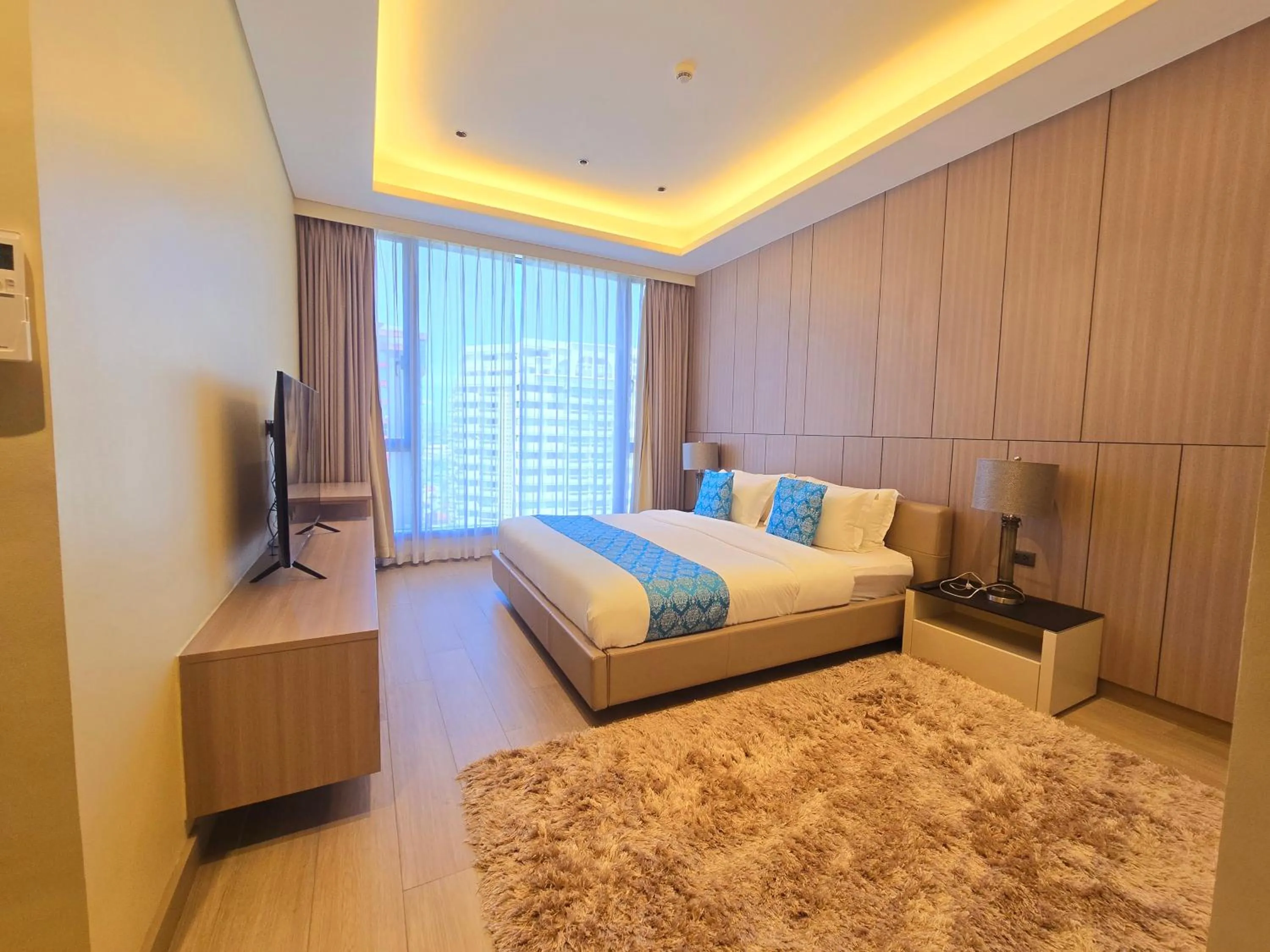 Bed in Bayprime Hotel