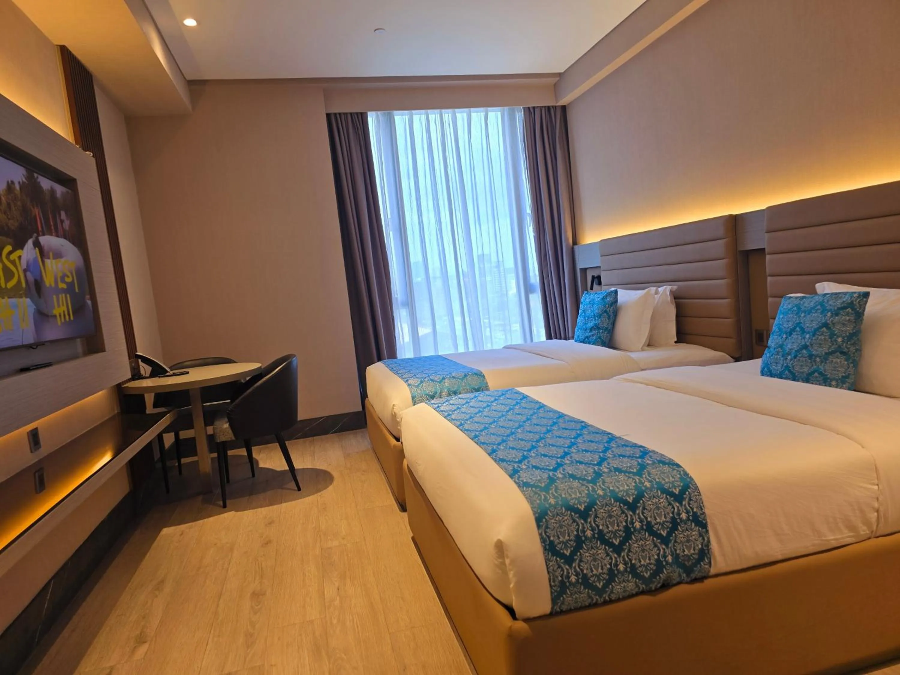 Bed in Bayprime Hotel