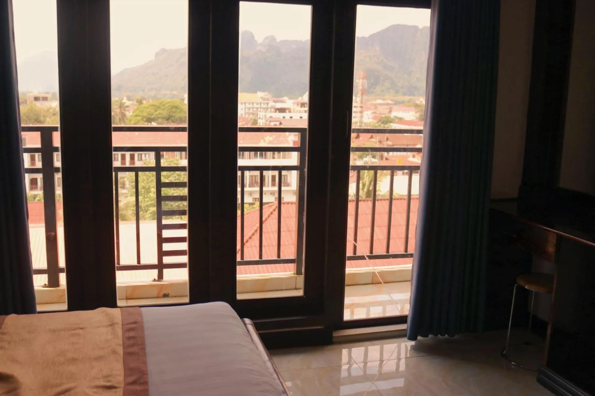 View (from property/room), Bed in Vang Vieng Consiana Hotel