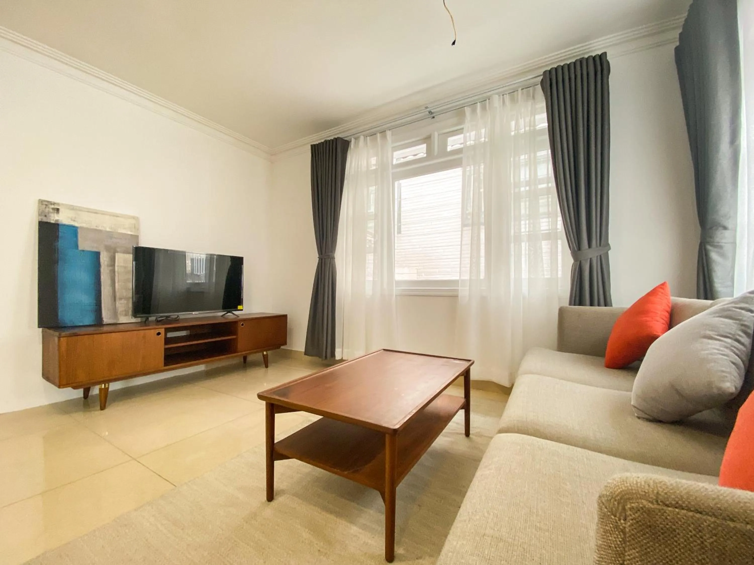 Communal lounge/ TV room in Zeus Living - Room in Villas An Phu