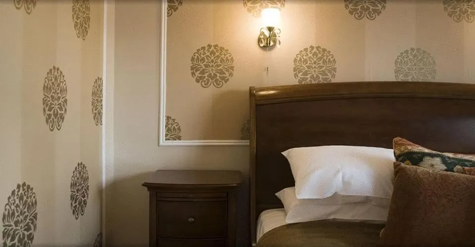Decorative detail, Bed in The Falcon Hotel