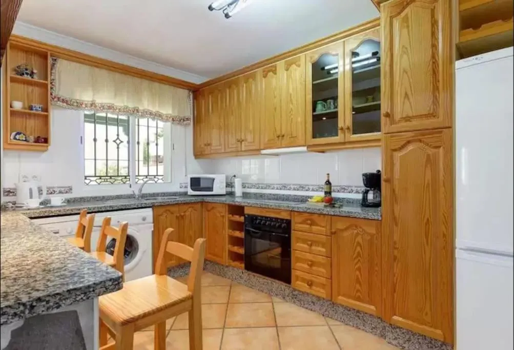 Kitchen or kitchenette in Villa Pastora