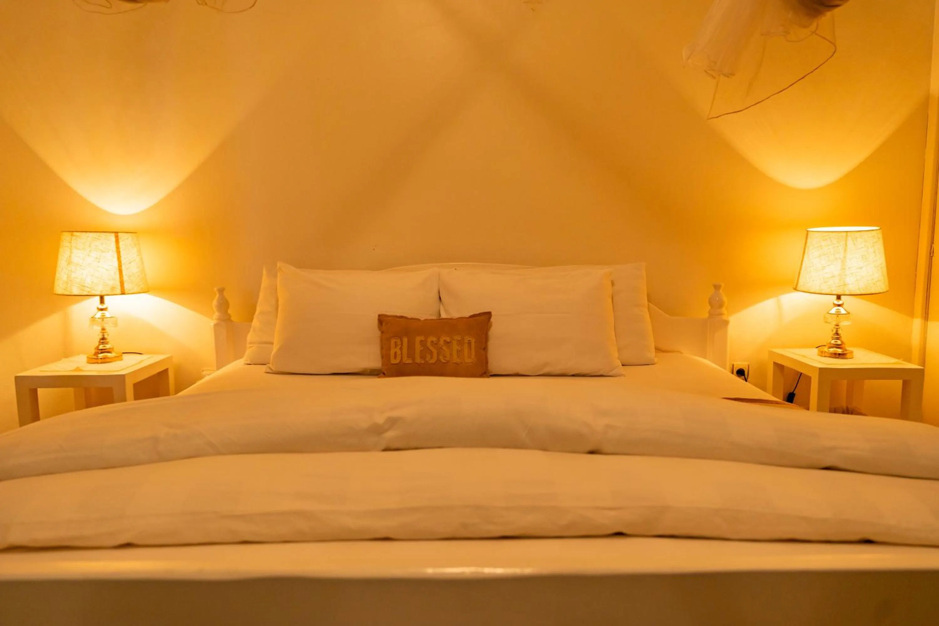 Bed in Blue Veil Villa Hotel