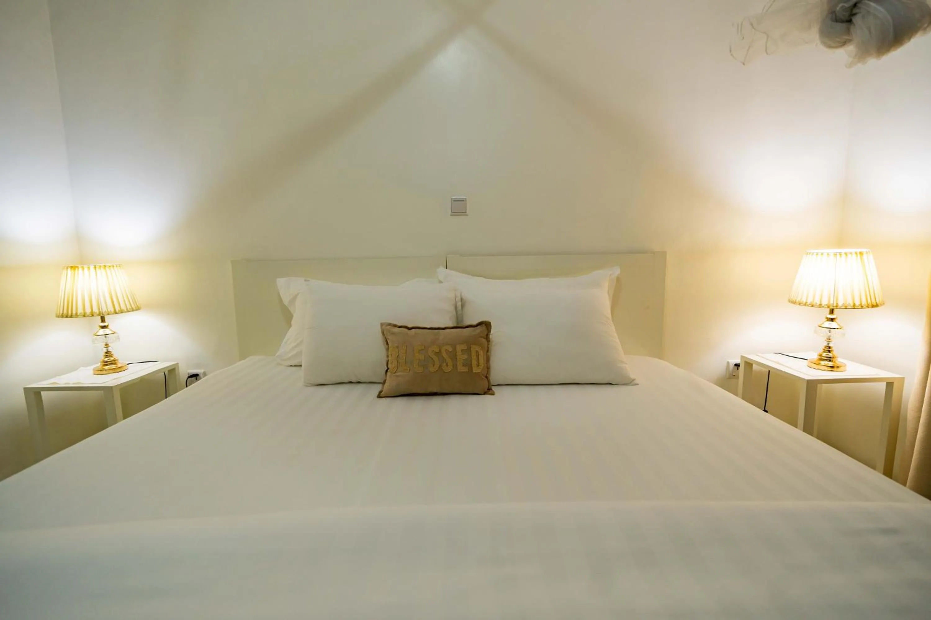 Bed in Blue Veil Villa Hotel