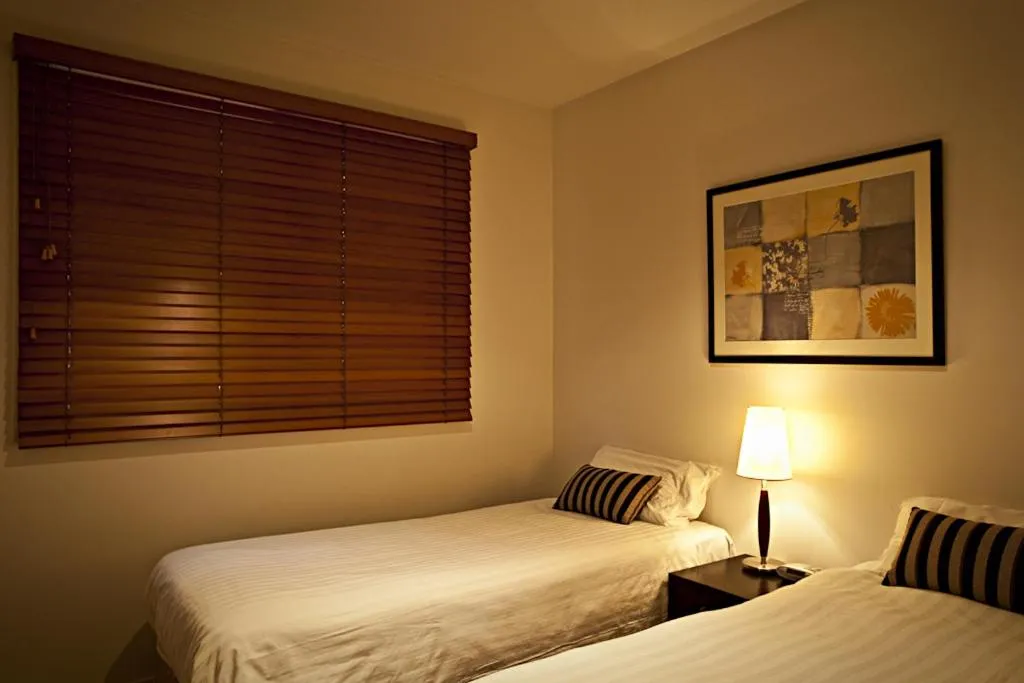 Photo of the whole room, Bed in Brighton Bay Apartments