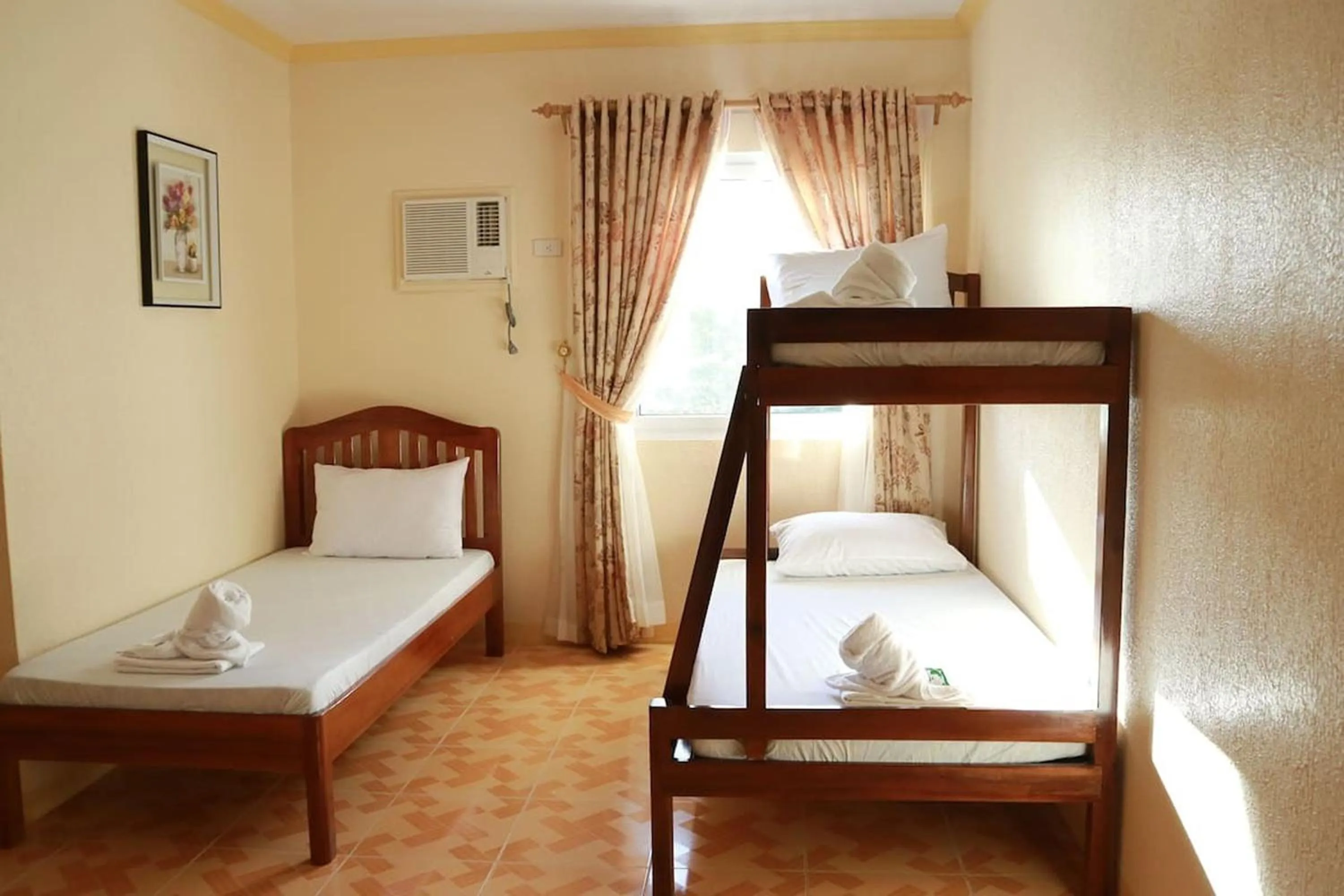 Photo of the whole room, Bed in Gilin Suites Puerto Princesa Palawan