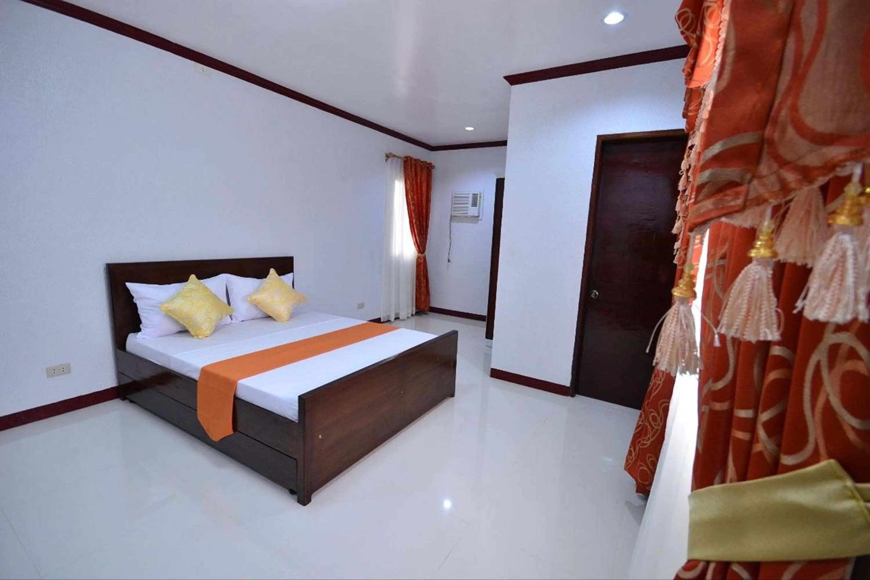 Photo of the whole room, Bed in Gilin Suites Puerto Princesa Palawan