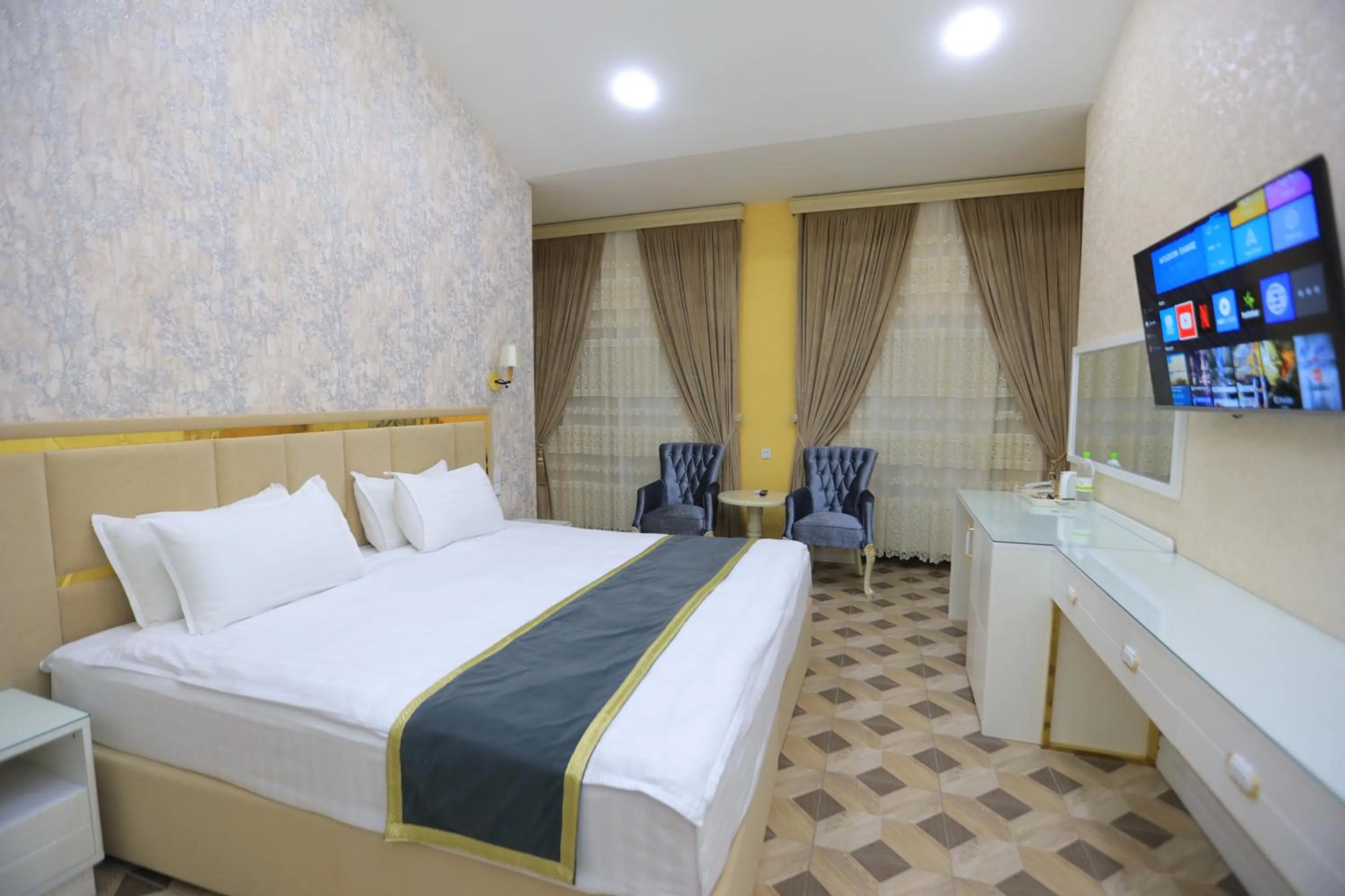 Bed in AYNIY Hotel